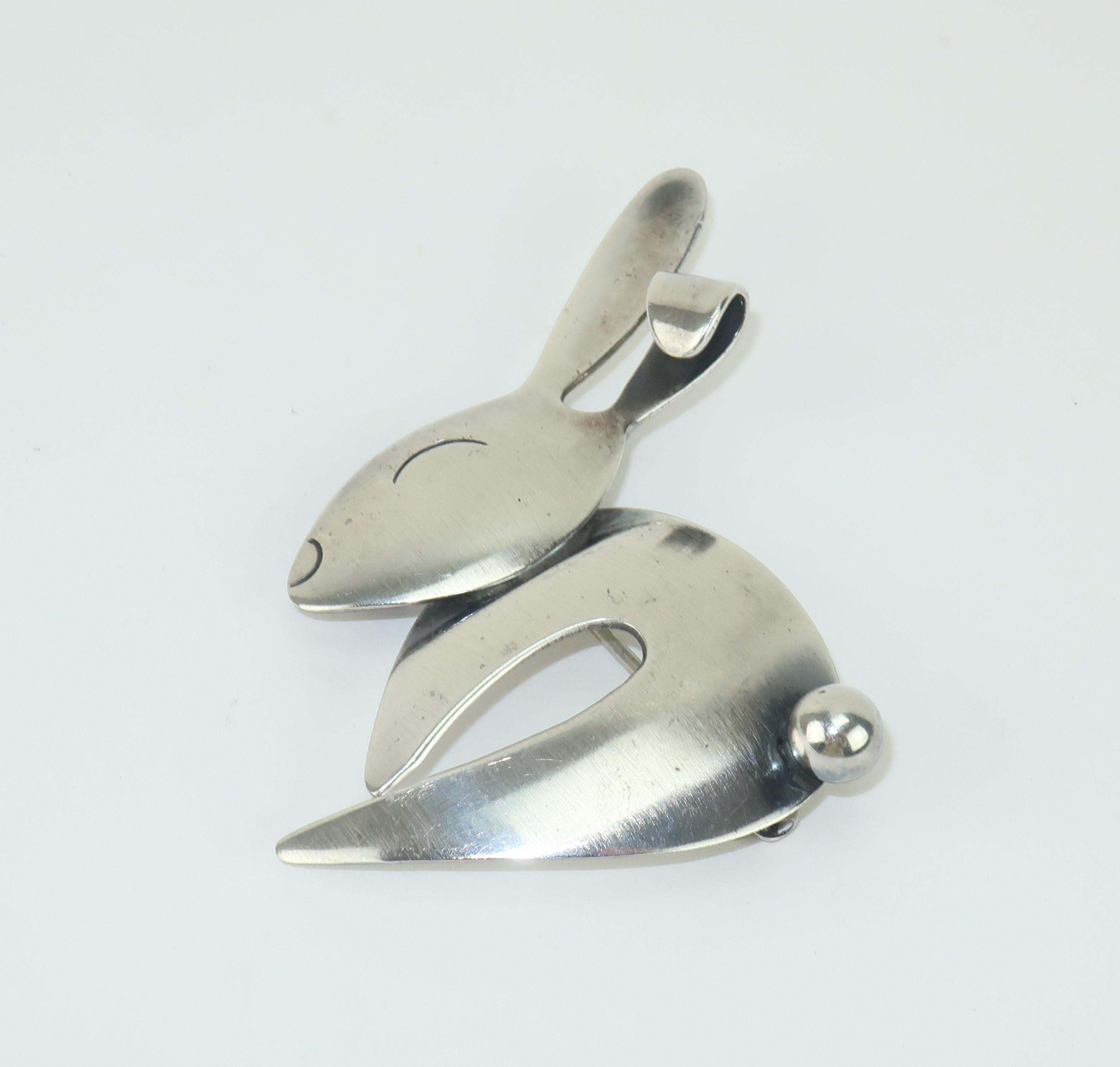 Add a touch of Spring to your lapel with a modernist sterling silver rabbit brooch by Otto Robert Bade for ORB Studios.  The charming design has a satin finish and is outfitted with straight pin and safety catch.  Signed and hallmarked at the back. 