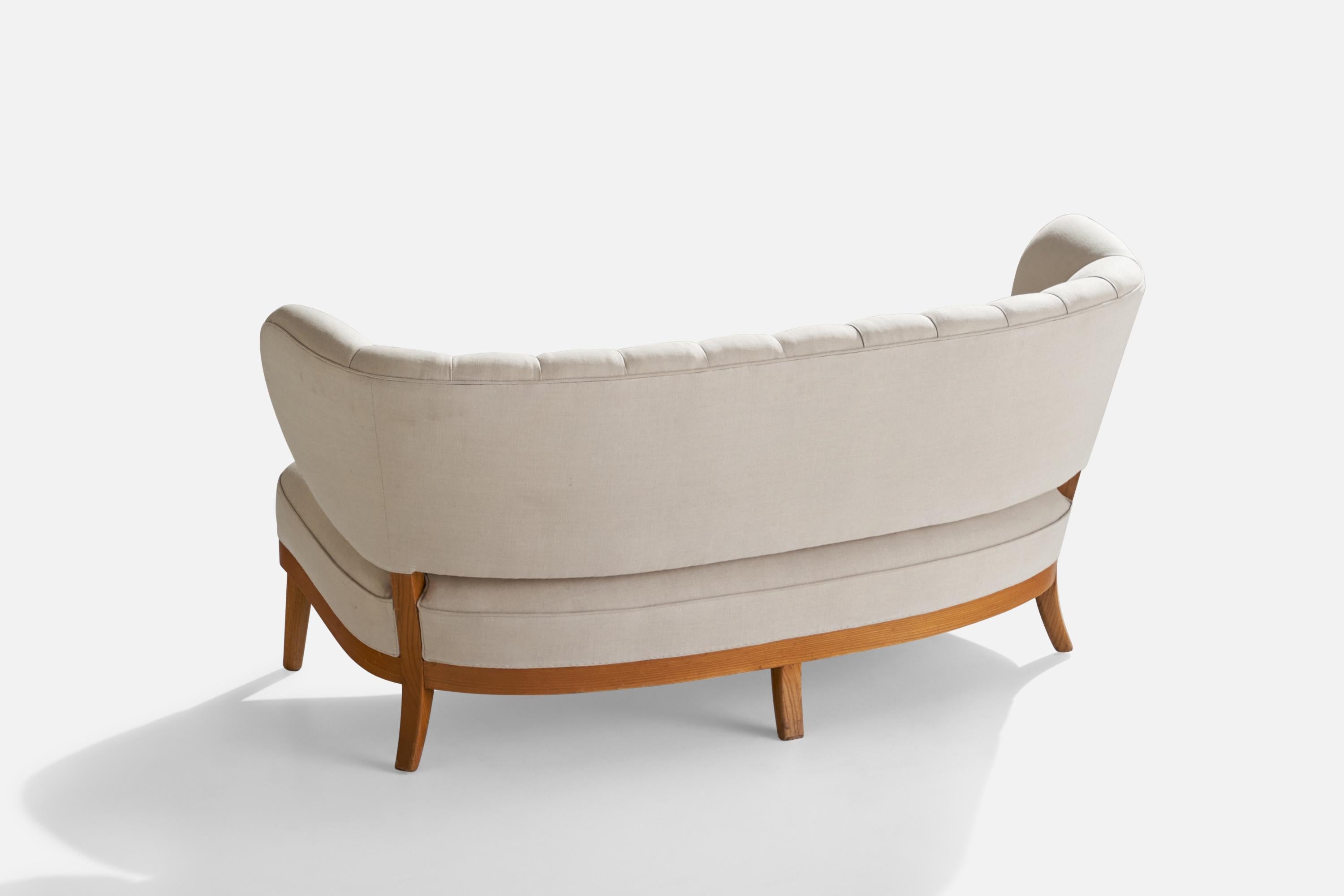 An off-white fabric and elm settee designed by Otto Schultz and produced by Boet, Sweden, c. 1940s.

Seat height 16”.