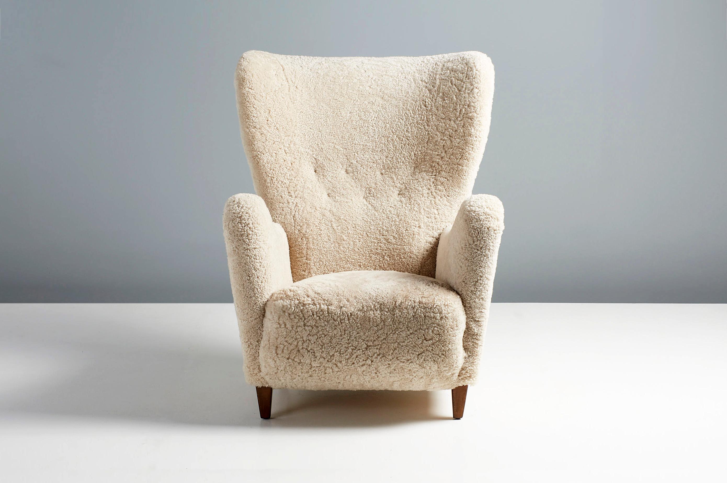 Otto Schulz Wing chair, c1940s

An imposing and impressive wing chair from Swedish master designer Otto Schulz, produced by hiss own company Boet in Gothenburg Sweden in the 1940s. The organic sweeping arms and wings mark this rare piece out from