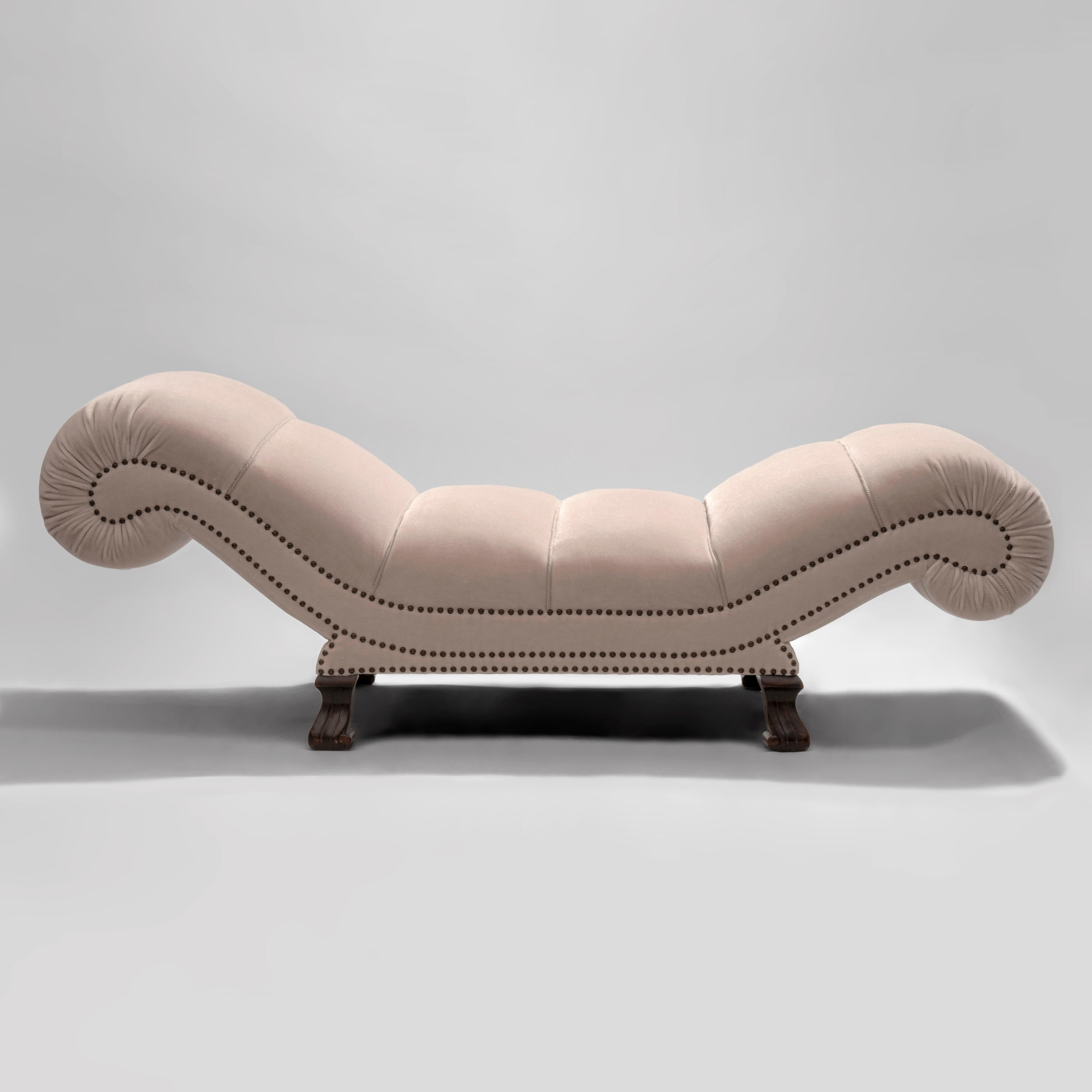 A large and supremely comfortable piece perfect for reading, relaxing and resting. Newly reupholstered in Maharam mohair. The perfectly contoured shape divided into gently rounded pads, each trimmed in cord, the ends scrolled under, the sides