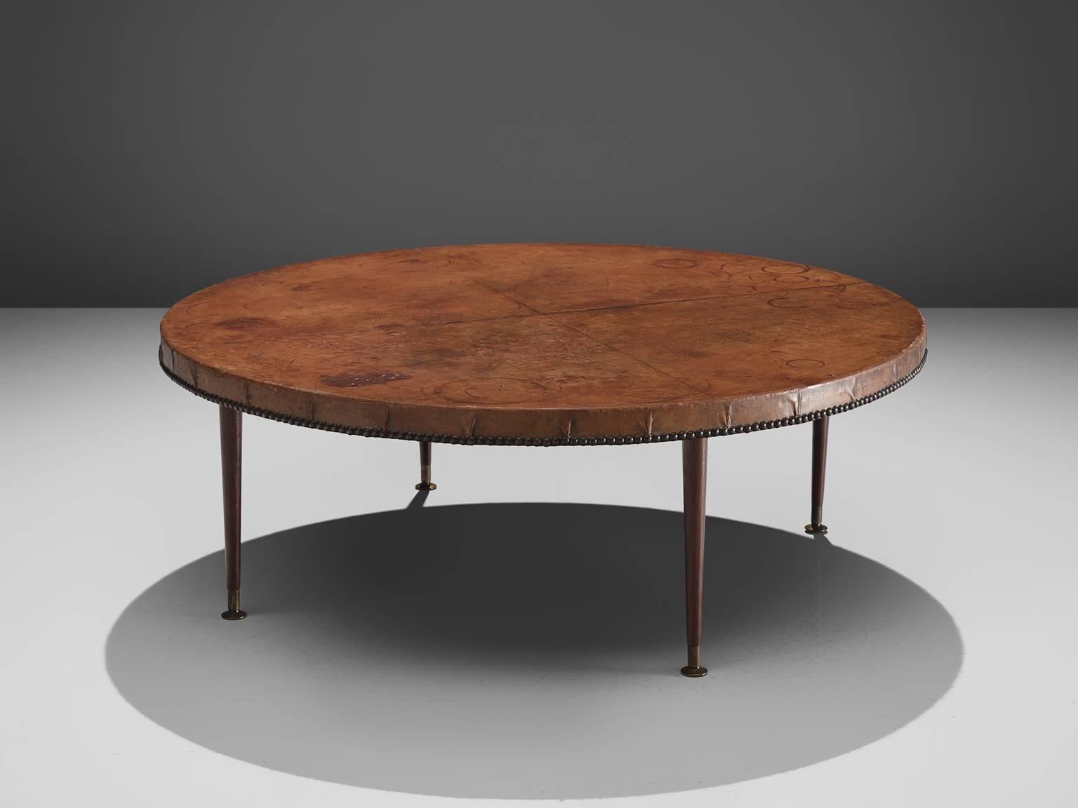 Otto Schulz for Boët, cocktail table, cognac niger leather and hardwood, Sweden, circa 1935.

This side table is designed by Otto Schulz for Boet, a company that Schultz founded himself. The table is executed with brass nails on the sides and the