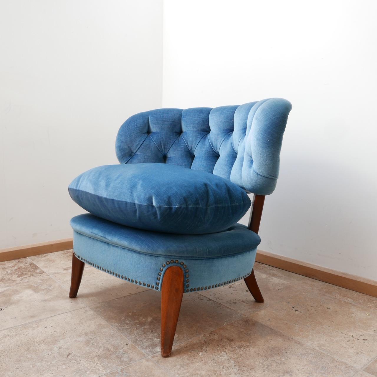 A lounge chair by Otto Schulz. 

Sweden, c1940s. 

Generous open wide design. 

Upholstered in blue plush fabric with characteristic thick cushion which remains in near perfect condition. 

Produced by Boet.

Dimensions: 85 W x 57 D x 48