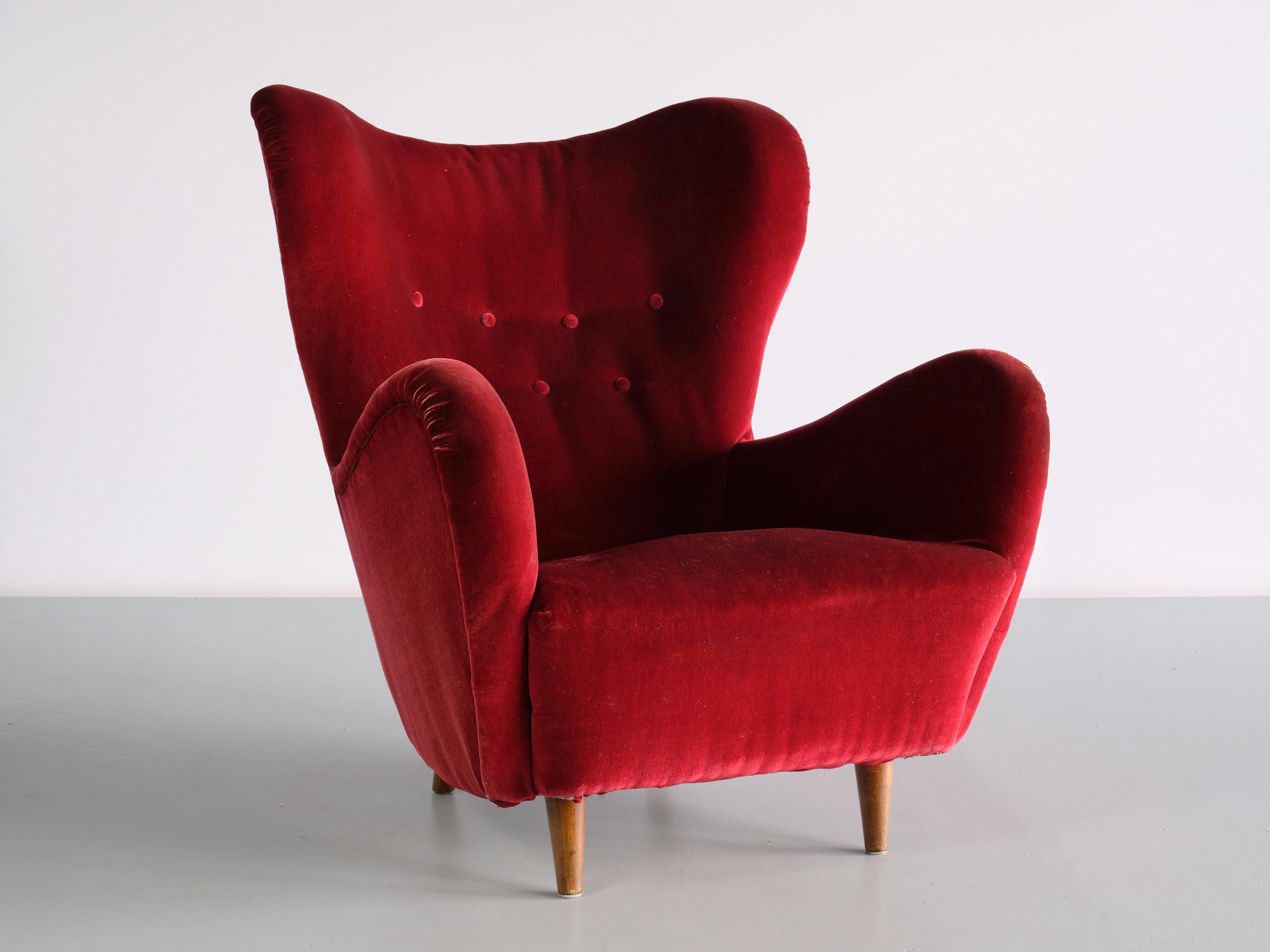 This exceptionally rare armchair was designed by Otto Schulz and produced by Boet in Go¨teborg, Sweden, 1946. The rounded, organic lines of the design create a striking silhouette. Its generous proportions and the high back make this a sumptous and