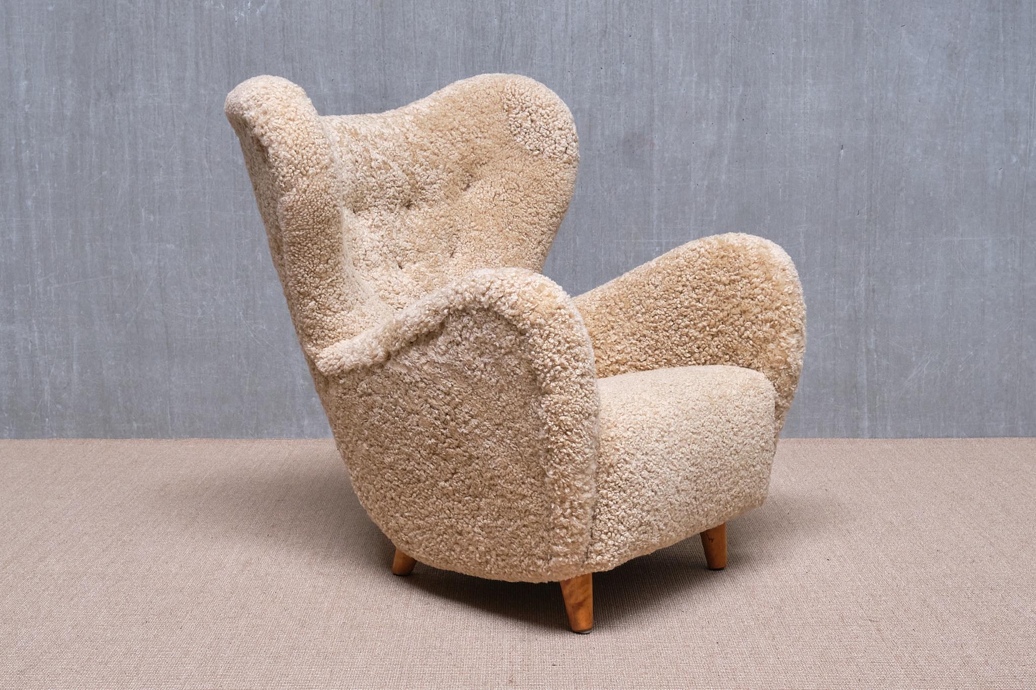 This exceptionally rare armchair was designed by Otto Schulz and produced by Boet in Gothenburg, Sweden, in 1946. Its rounded, organic lines create a striking yet inviting silhouette. With generous proportions and a high back, it offers a sumptuous