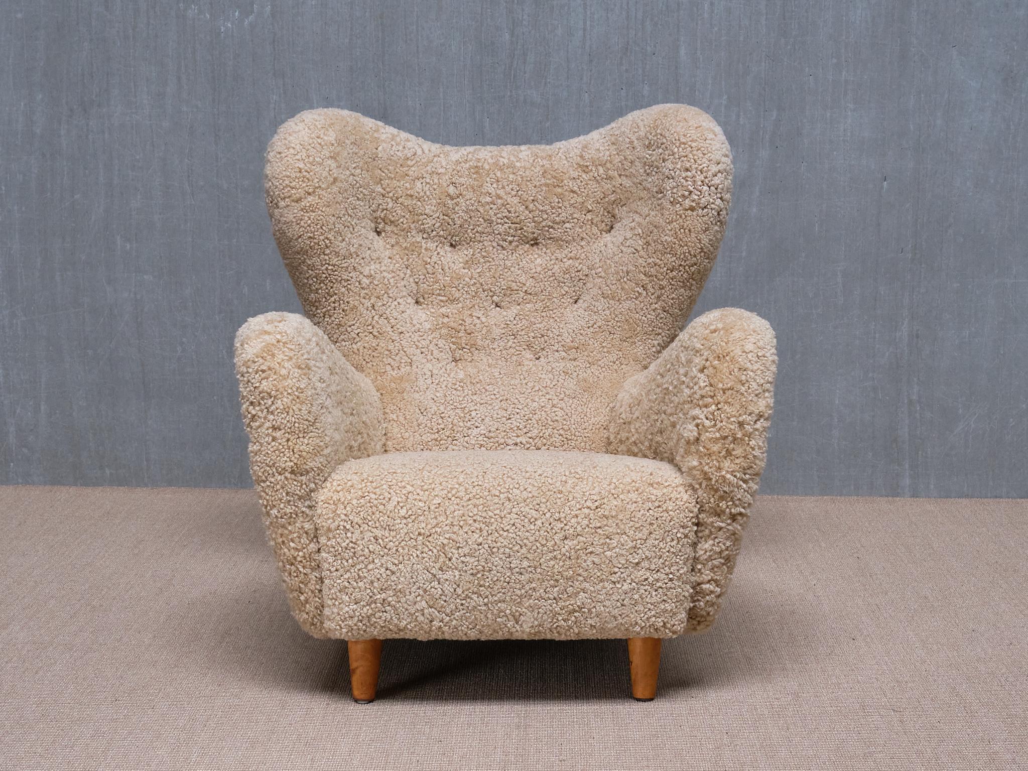 Scandinavian Modern Otto Schulz Wingback Chair in Sheepskin and Birch, BOET, Sweden, 1946 For Sale