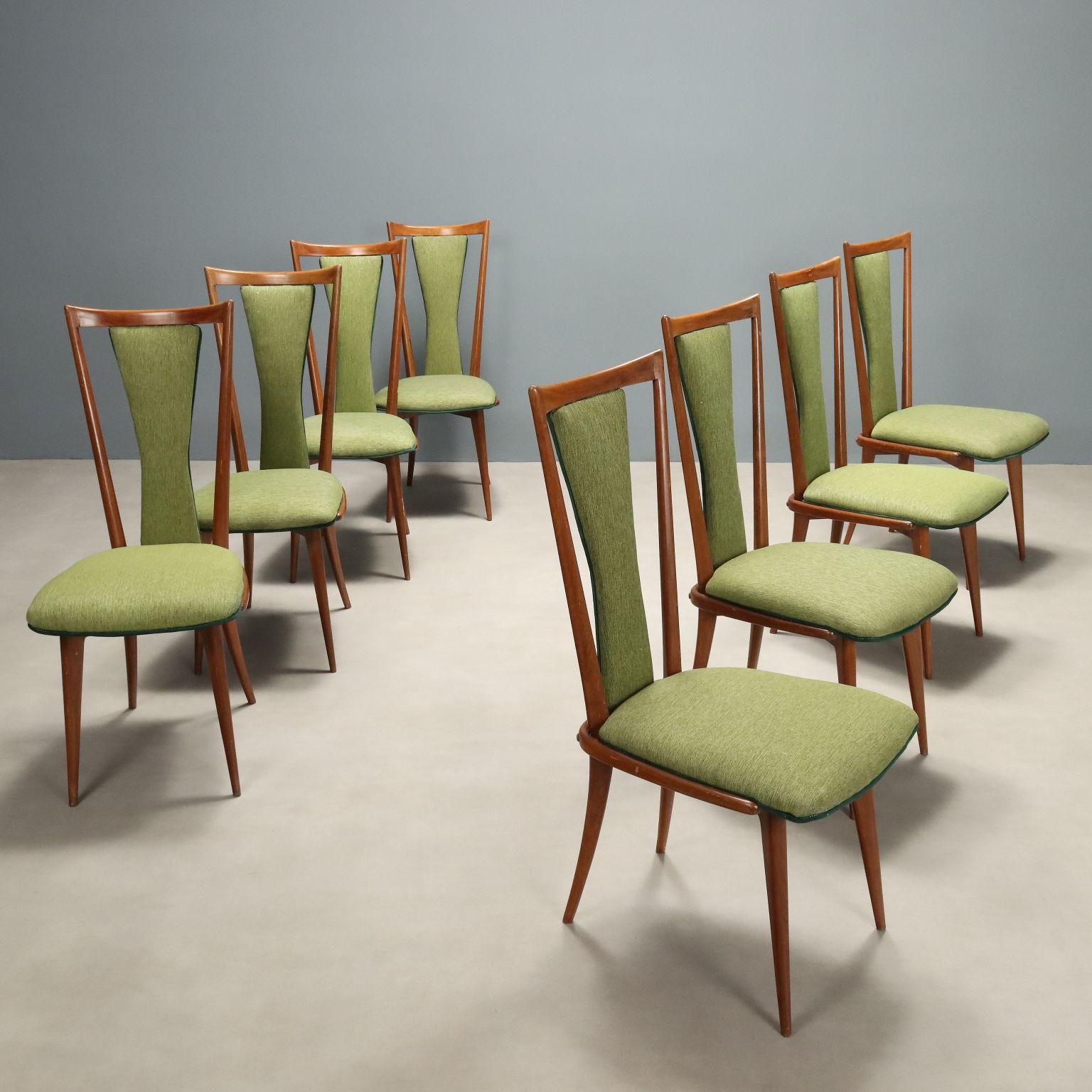 Set of eight elegant vintage dining chairs with wooden frame, foam-filled seat and back and fabric upholstery in shades of green. Chairs ready to be restored in the wooden part and renewed in the upholstery choosing from the many proposals in our