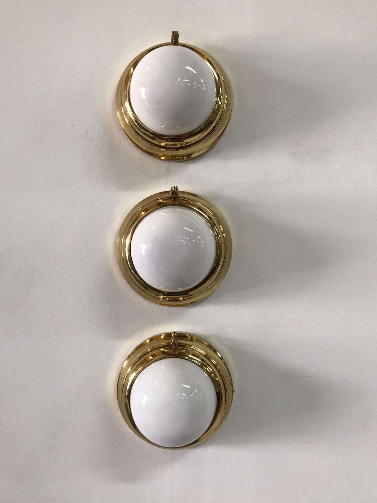 These small sized lights have been rewired for USA. Wall or ceiling light with opaline glass, pictured in brass, designed for the Viennese trams. We are selling them individually in this size and 3 others in a larger scale (see other listing on