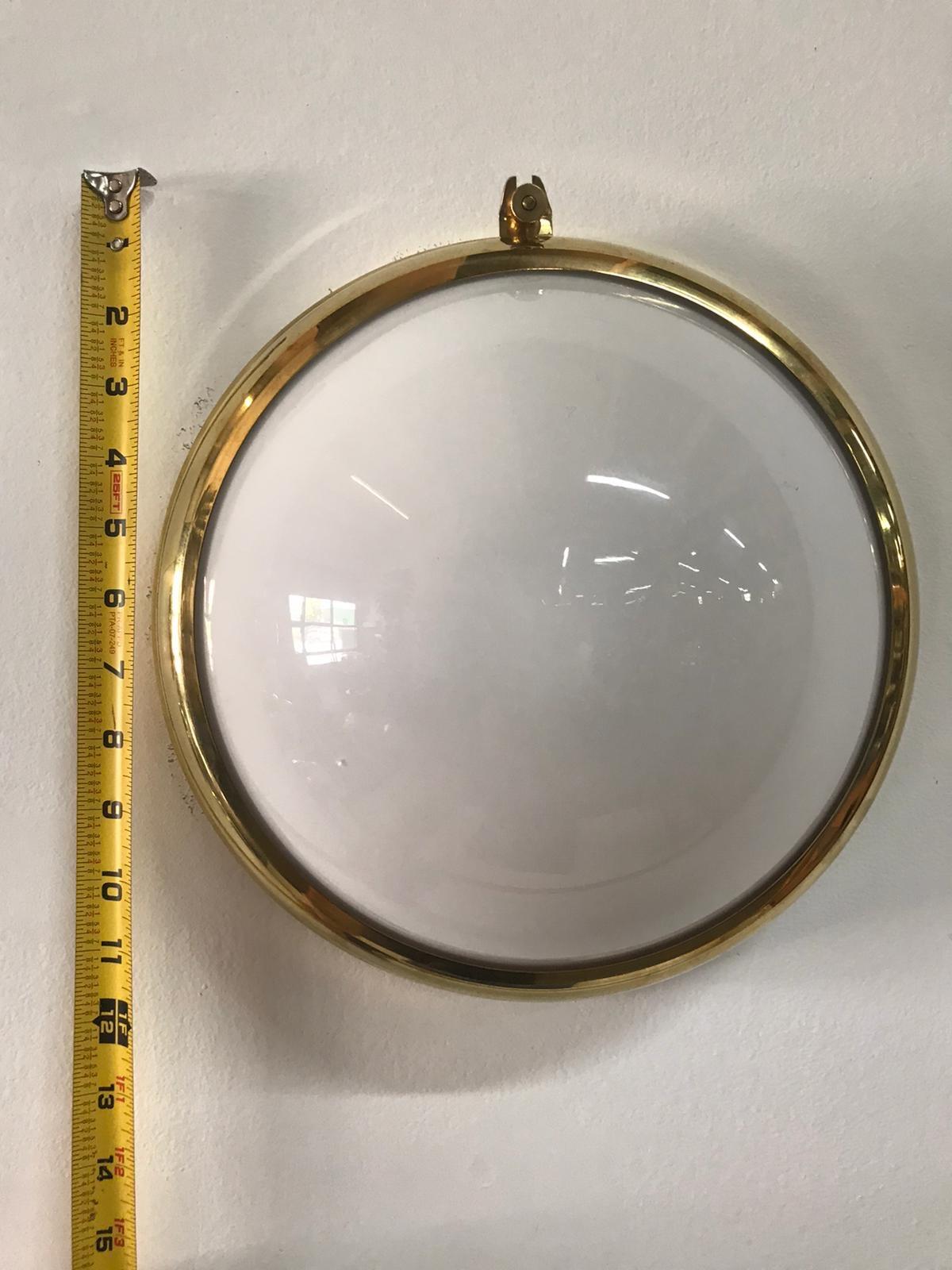 These vintage and all original medium sized lights have been rewired for USA. Wall or ceiling light with opaline glass, pictured in brass, designed for the Viennese trams. We are selling them individually in this size.
