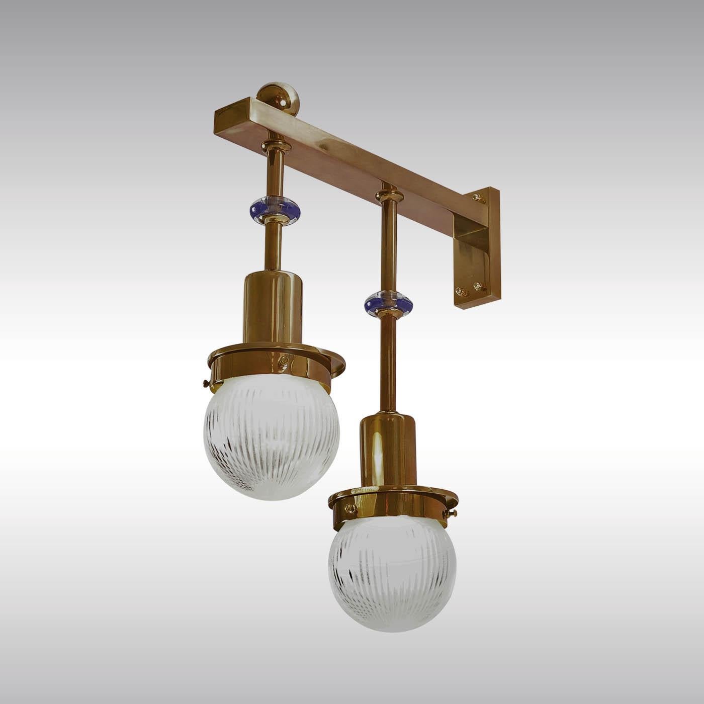 Wall-lamp for the famous Steinhof-Church in Vienna, built in 1904.
Available in different finishes. 
Originally manufactured at the Wiener Werkstaette Atelier, now custom-made production at the Woka Lamps Workshop in Vienna.

Most components