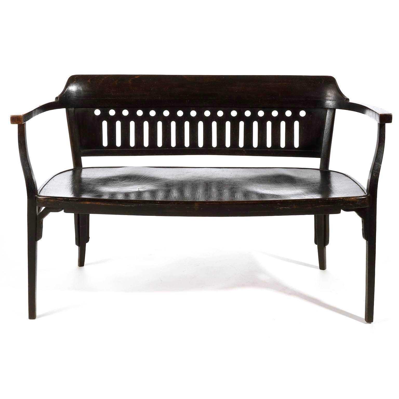 A Vienna Secession bentwood settee by Otto Wagner and manufactured by Thonet, Austria, circa 1900.

This settee is an authentic piece which is in great original condition with nice patina. It is made of dark brown (almost black) stained beech wood