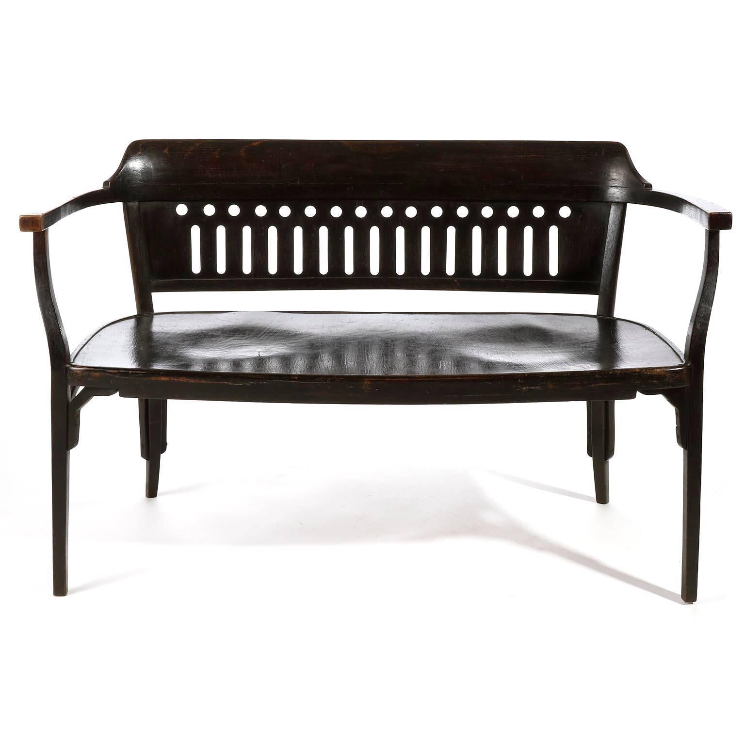 A Vienna Secession bentwood settee by Otto Wagner and manufactured by Thonet, Austria, circa 1900.

This settee is an authentic piece which is in great original condition with nice patina. It is made of dark brown (almost black) stained beech wood 