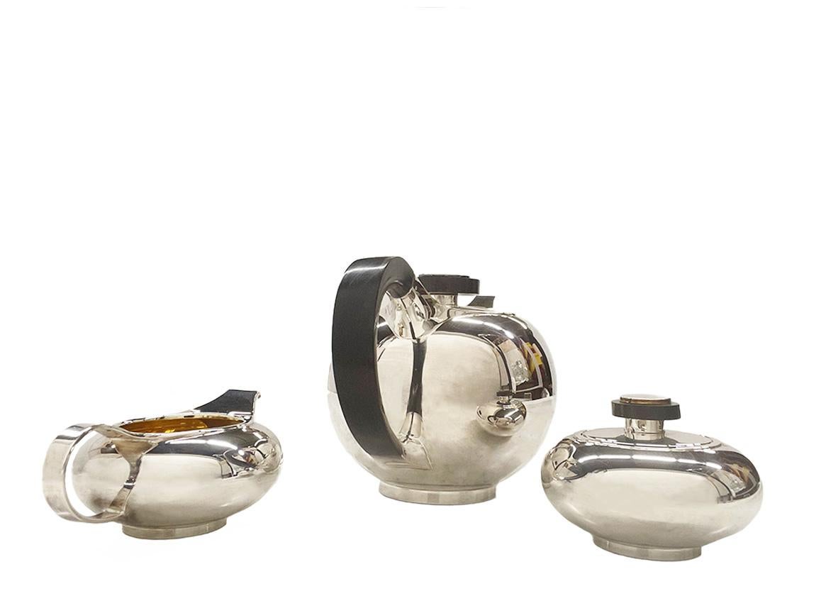 Otto Wolter, German Sterling Silver Tea set, Mid 20th Century

A 3 piece  German Sterling Silver tea set by Otto Wolter (1875-1991), consisting of a teapot, milk jug and a sugar bowl with lid. The sugar bowl and milk jug are gold plated on the
