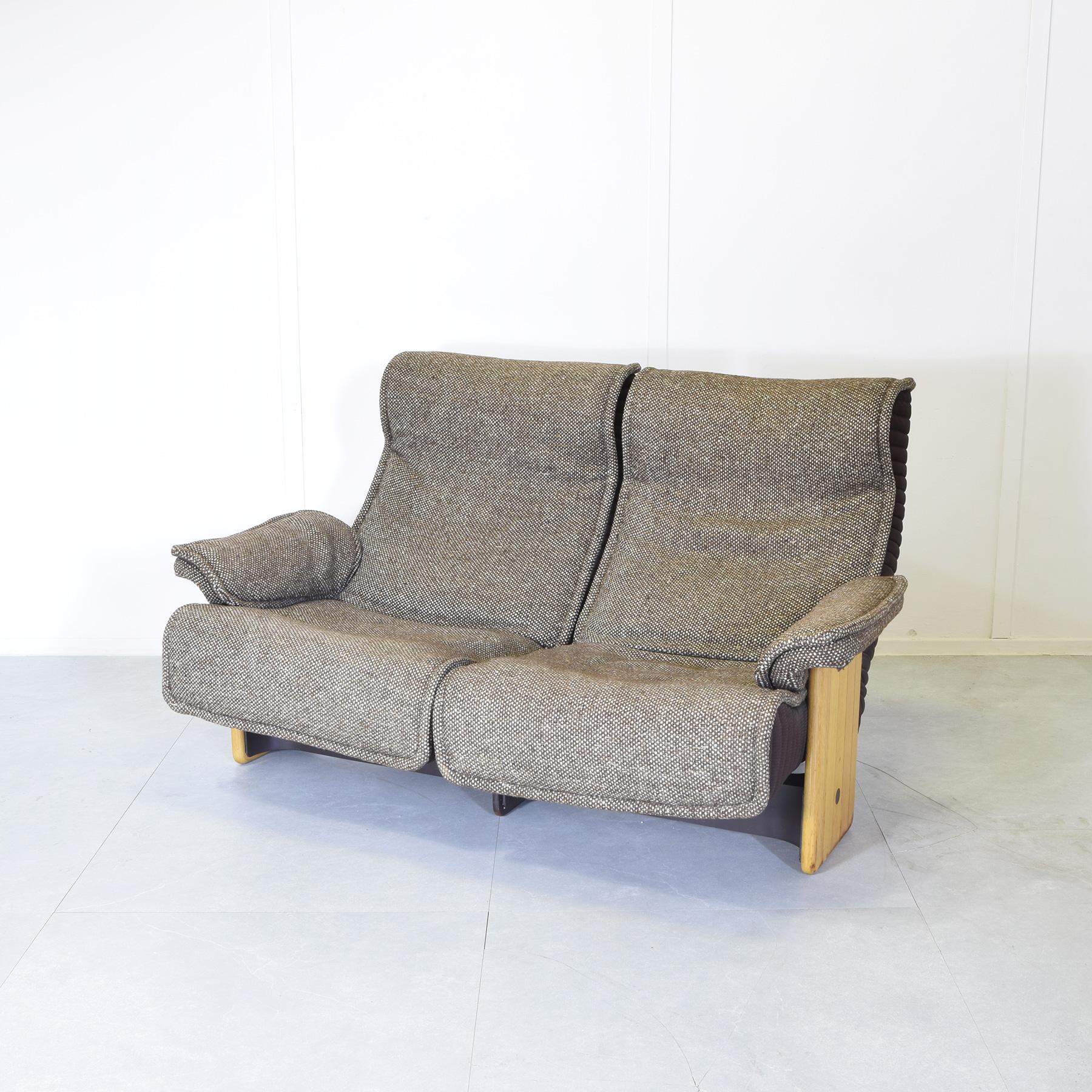 Original comfortable Follow Me two-seater sofa maple wood frame and original fabric seats in good condition, designer Otto Zapf for Koll International 1970s production.

The seat is slightly reclining

Industrial designer Otto Zapf was born into a
