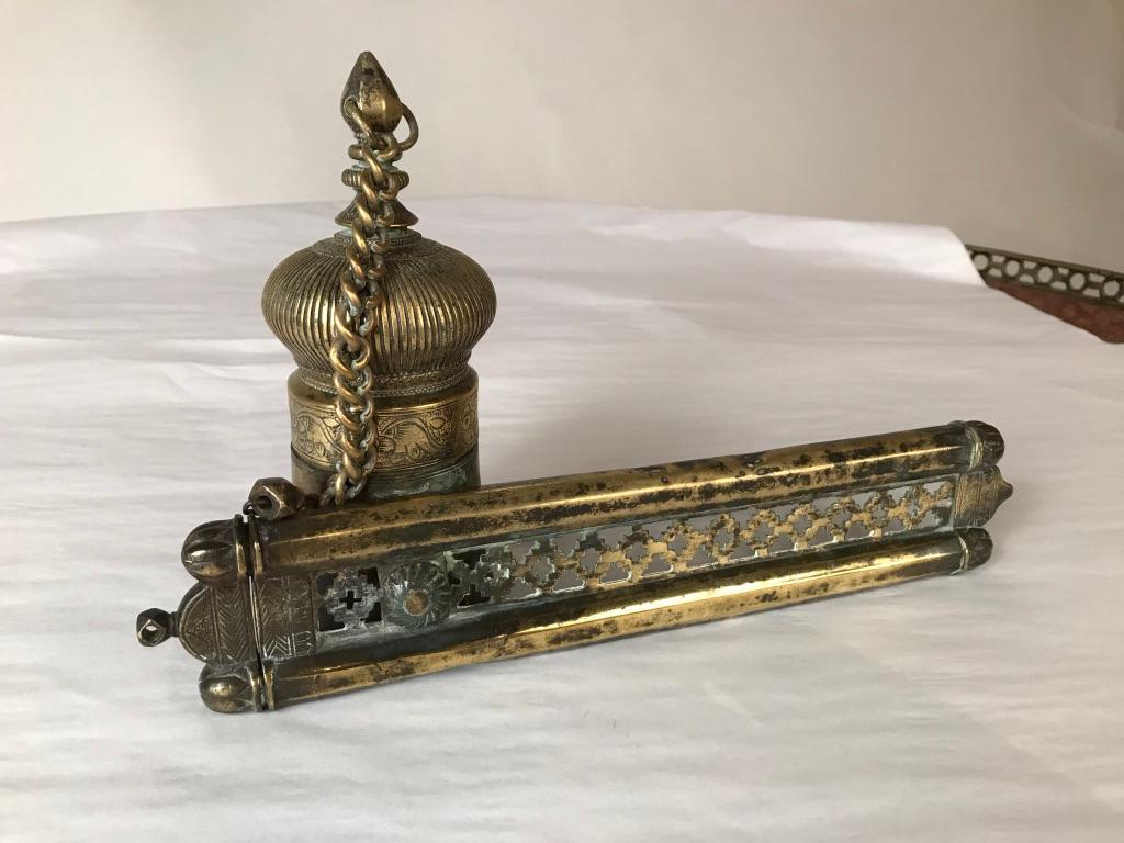 Exceptional Turkish etched brass Qalamdan, a traveling scribe's inkwell and pen case. The beautiful dome topped inkwell is rare, it is attached by chain to the pen case, consisting of two tubes for quill or reed pens. Clearly a well used artifact,