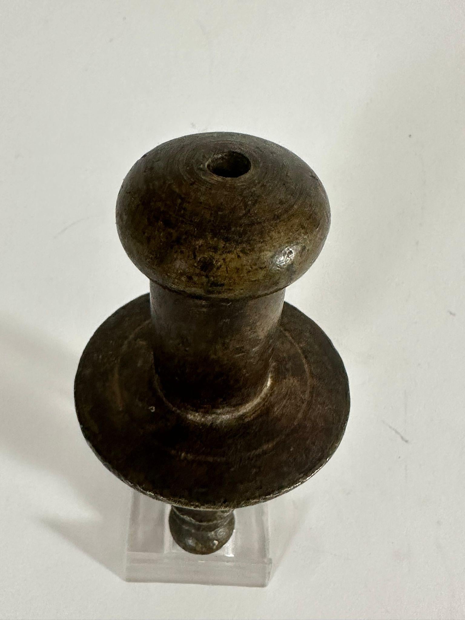 This handmade bronze plumb bob dates back to circa 1800 during the Ottoman period in what is now Israel (historically known as Eretz Israel). Crafted with precision, this tool was used by local builders and artisans to ensure vertical alignment when