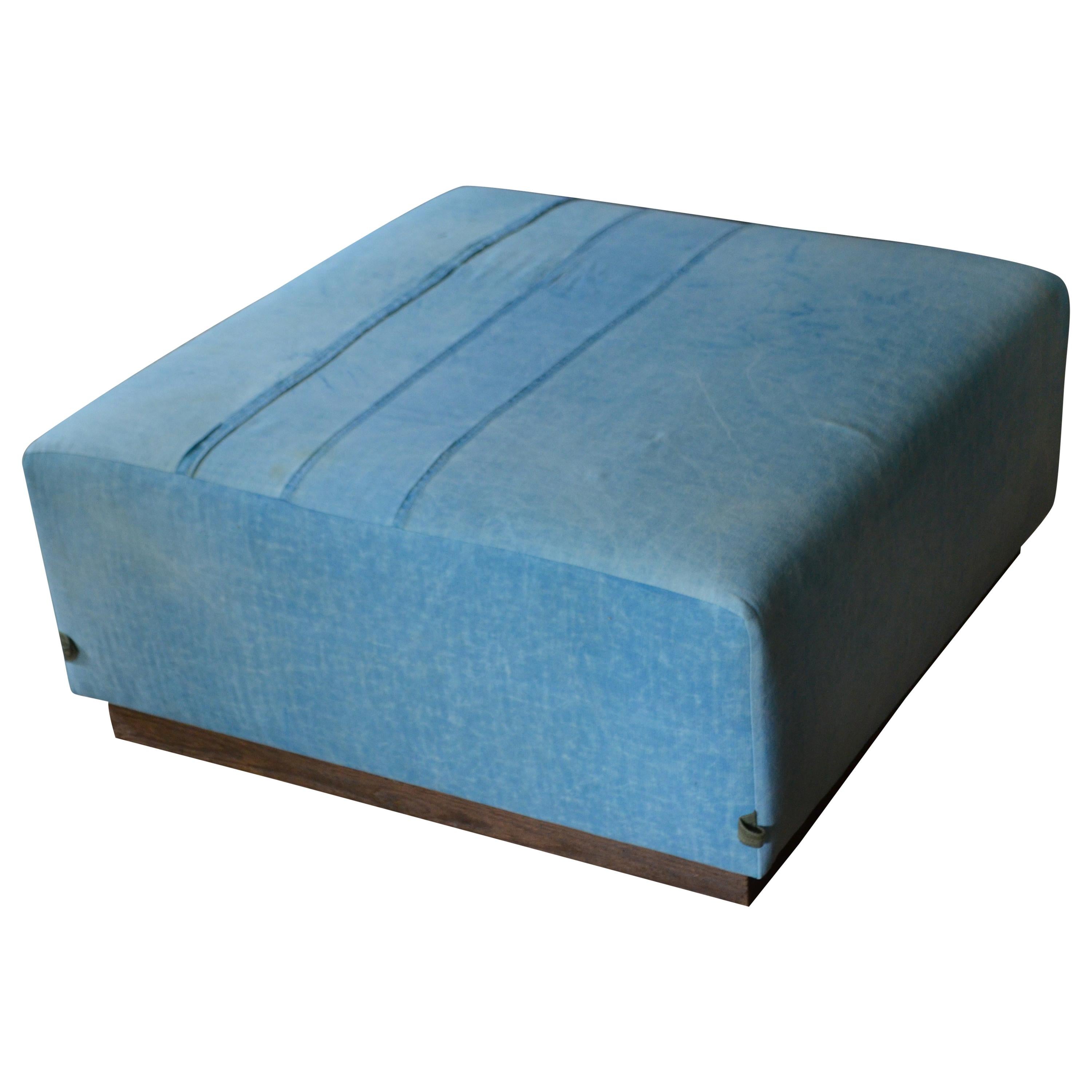 Ottoman Coffee Table Upholstered in 1960s Blue Tent Canvas Atop Barn Wood Base For Sale