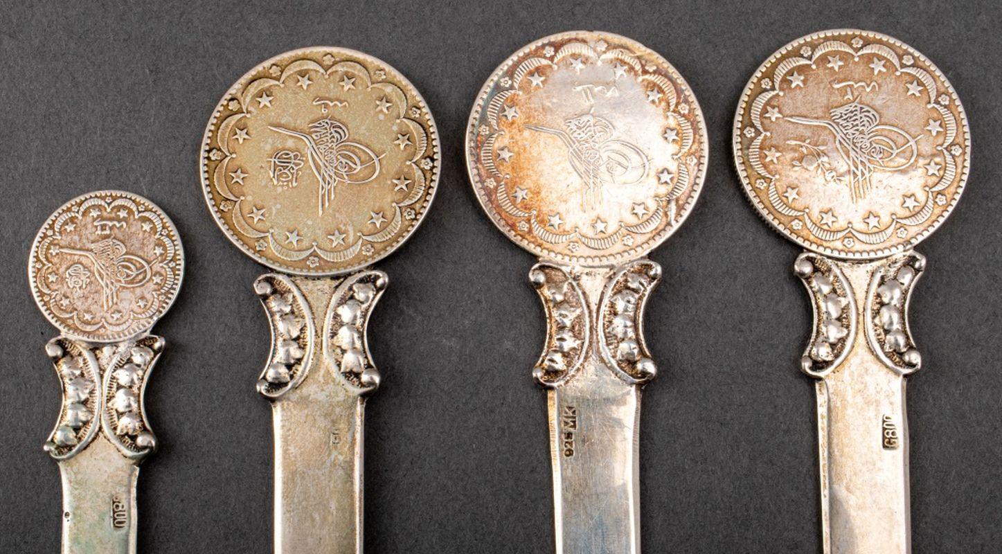 Group of Four Ottoman Coin-Set Turkish Silver Letter Openers, late 19th century, coins bearing the Tugrha, possibly for Sultan Abdul-Hamid II, one marked 925 and three marked 800, with various unknown makers' marks. Weight: 5.42 ozt.; Longest: 7.5