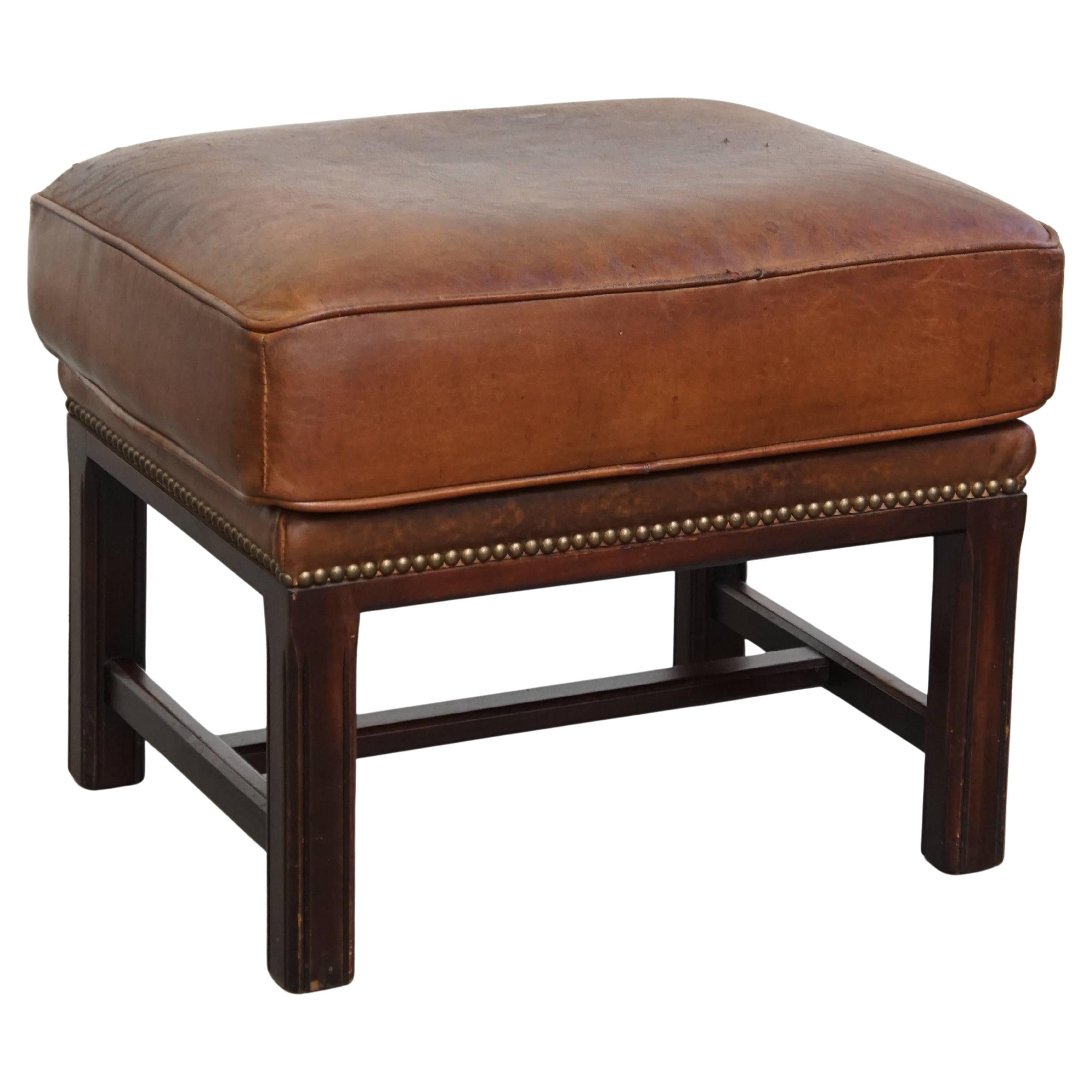 Ottoman made of sheepskin leather with wooden frame