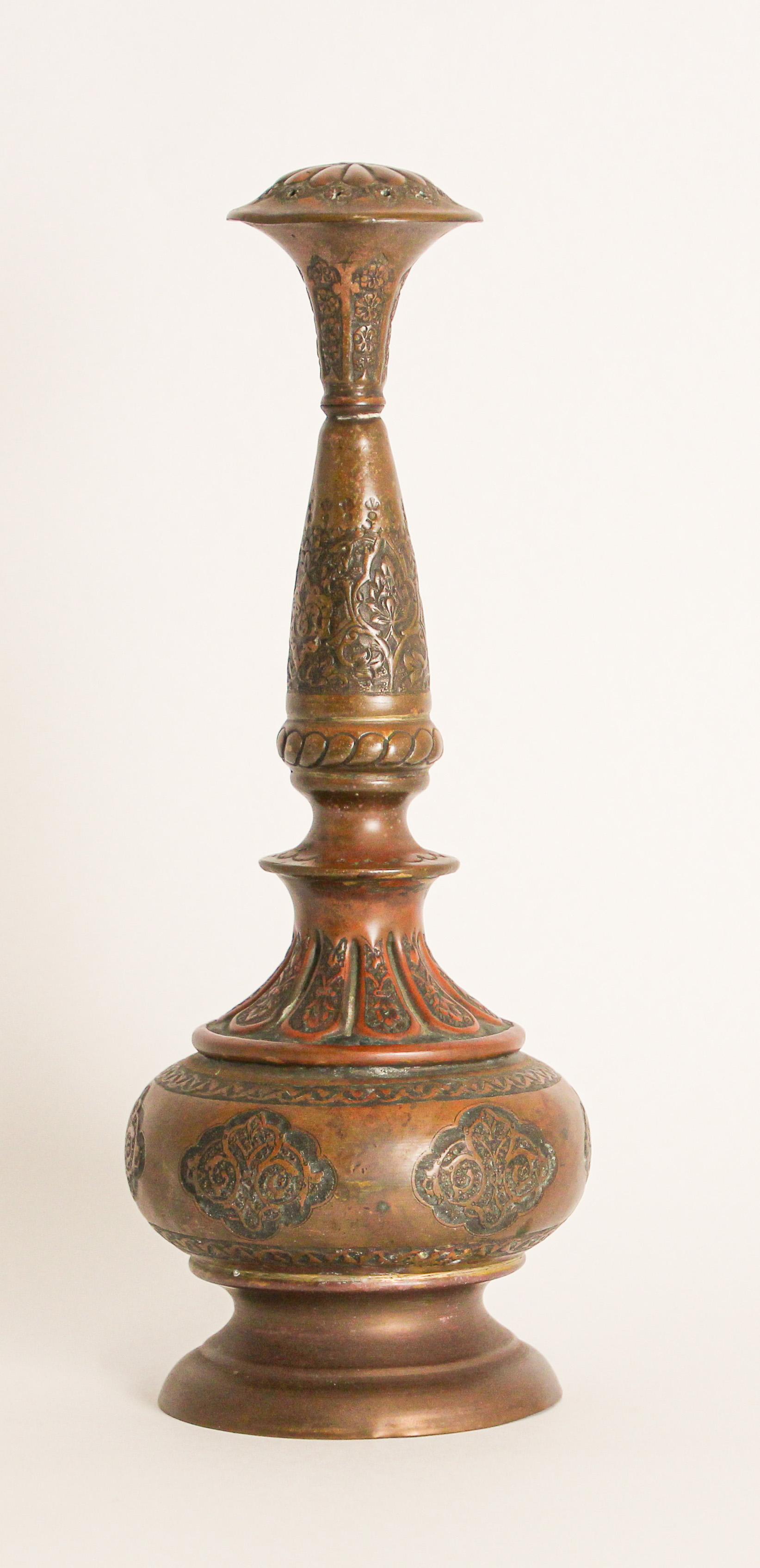 Turkey, 19th century, antique handcrafted ottoman Moorish decorative copper rosewater perfume sprinkler.
Embossed and hand chased, engraved and punched decoration to body with floral and geometric Islamic Moorish designs with screw-able top with