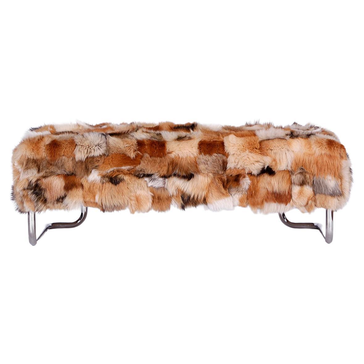 Ottoman or coffee table with real for fur!
This tubular steel bench from the 1970s has been completely reupholstered and covered with very nice genuine vintage fox fur. The chromed tubular steel has been polished and the old upholstery springs