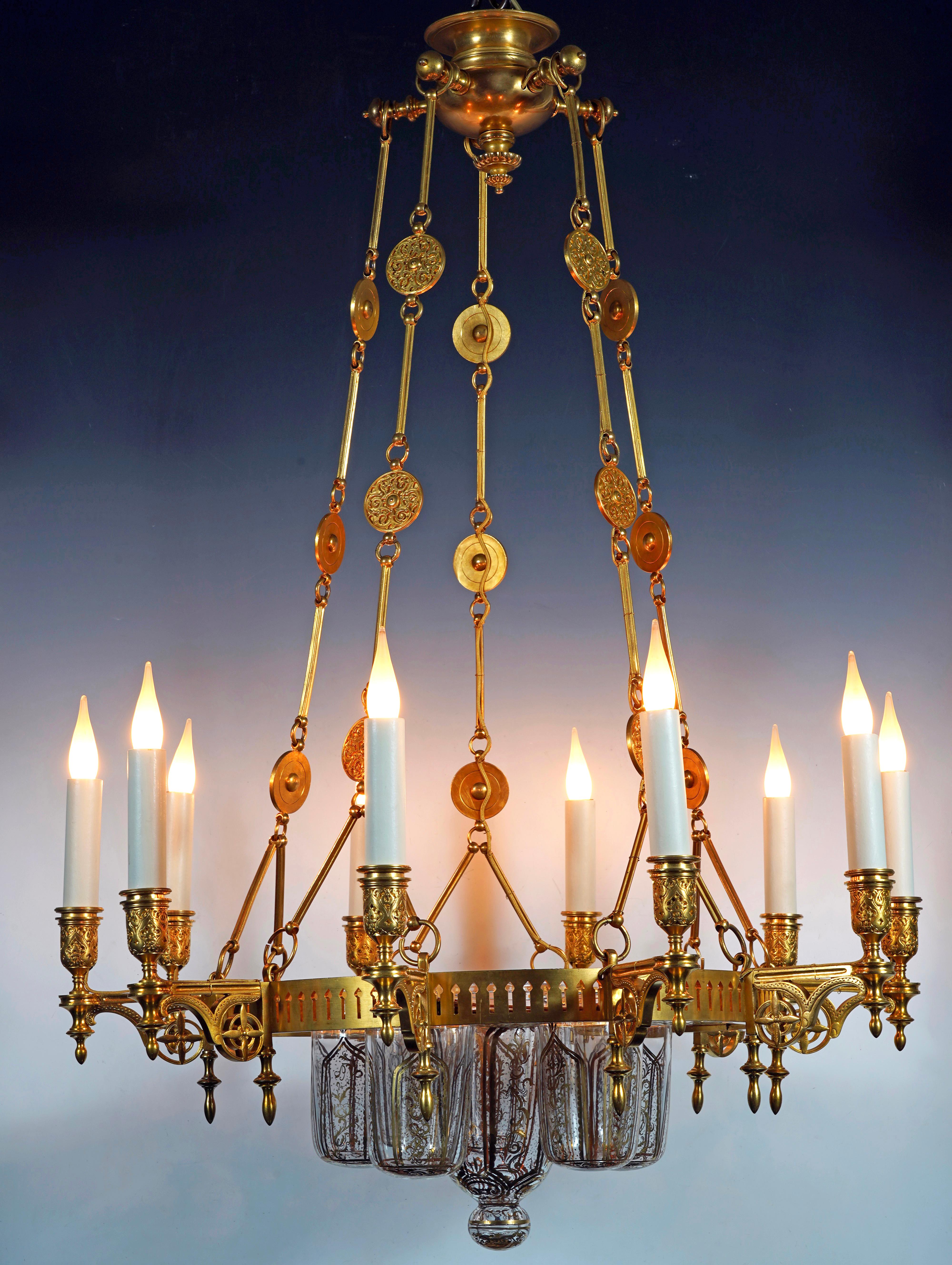 Signed F. Barbedienne

Rare Ottoman style gilded bronze chandelier composed of an openwork crown, from which ten arms of light emerge, holding six transparent glasses decorated with golden interlacing. The whole is attached to the ceiling light by