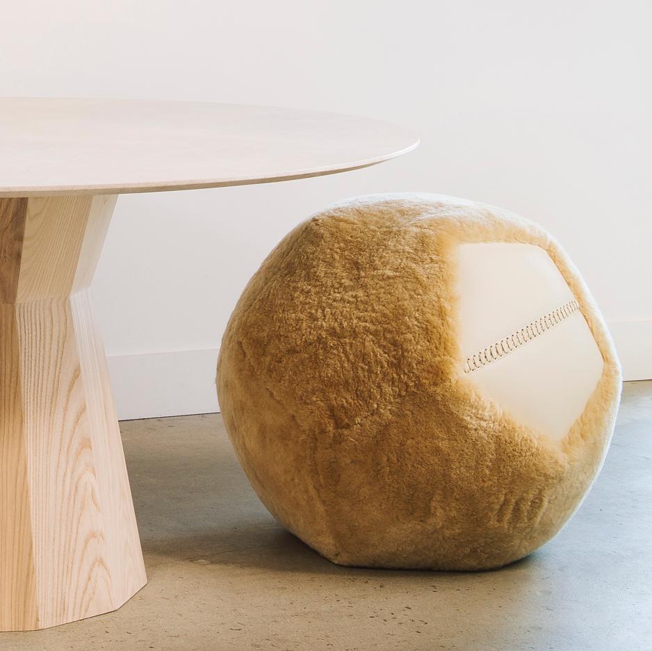 Round, sculptural and uniquely abstract, crafted with our plushest shearling, the Ottoman X is the coziest of our ottoman collection.
Our ottomans are hand-filled with compressed foam and finished with a single leather panel and an elongated