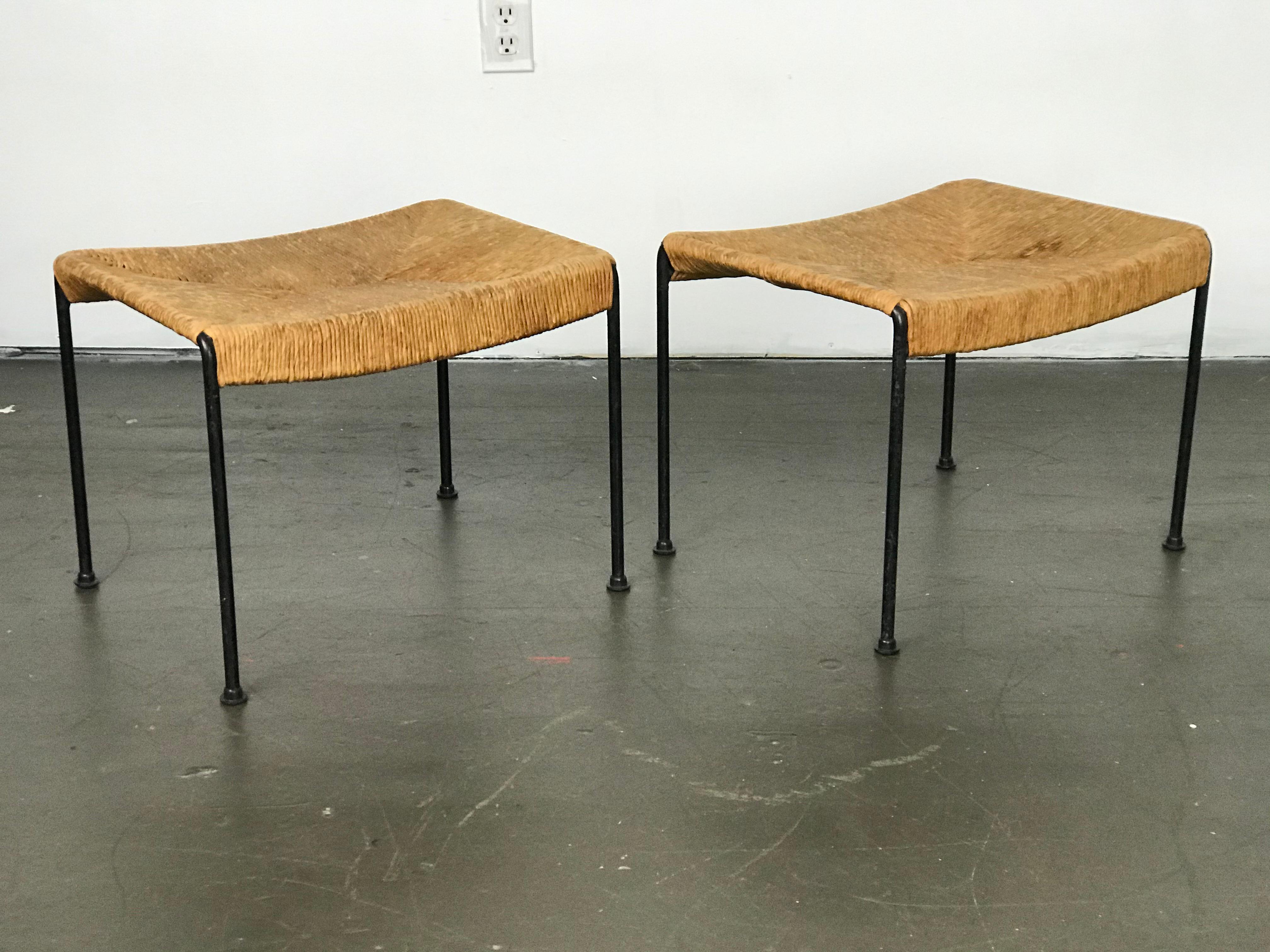 Set of two Minimalist footrests or stools by Arthur Umanoff for Shaver Howard, 1950s. Made of papercord rope and iron. Original condition. Areas of wear on the rope and iron. These pair nicely (or one of them) with the Umanoff settee I have for
