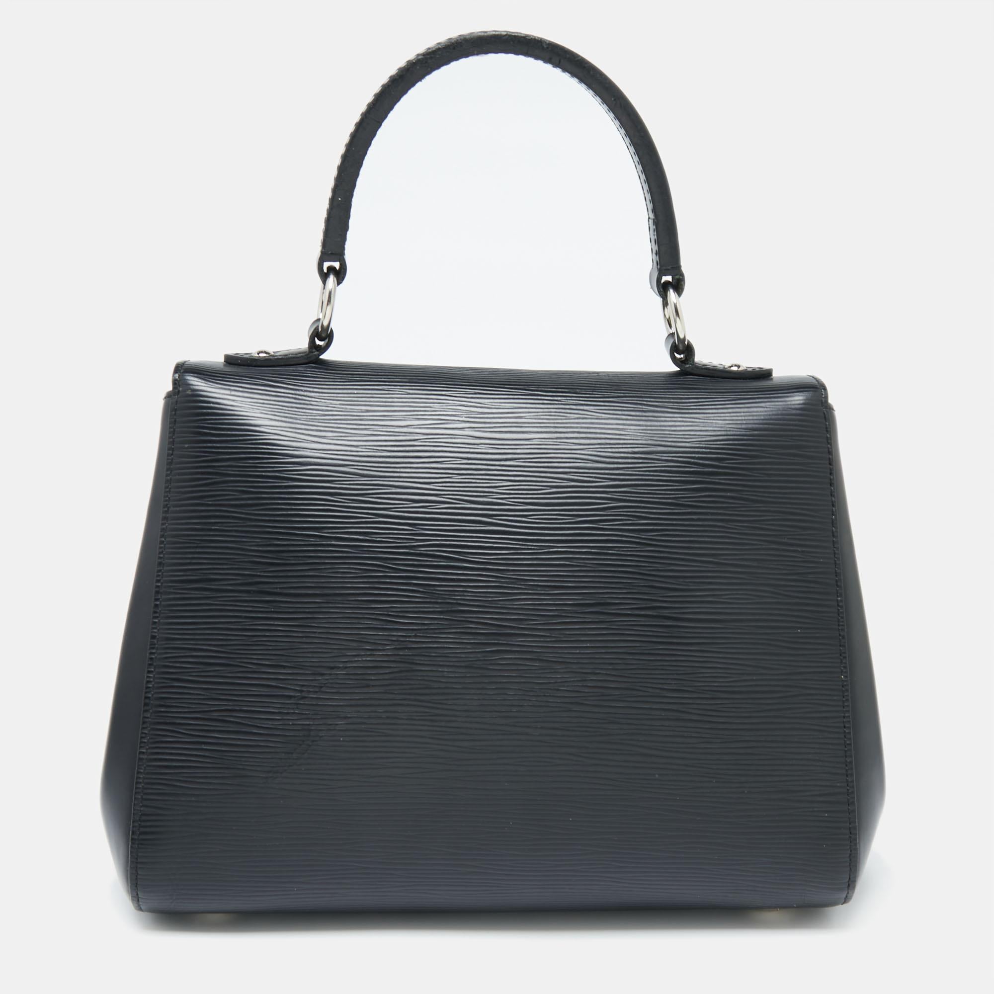 Each bag that comes out of Louis Vuitton's workshops is high on style and craftsmanship, including this beauty. Created from Epi leather, the Cluny bag has a fine finish. The bag features a top handle, a detachable shoulder strap, protective feet at