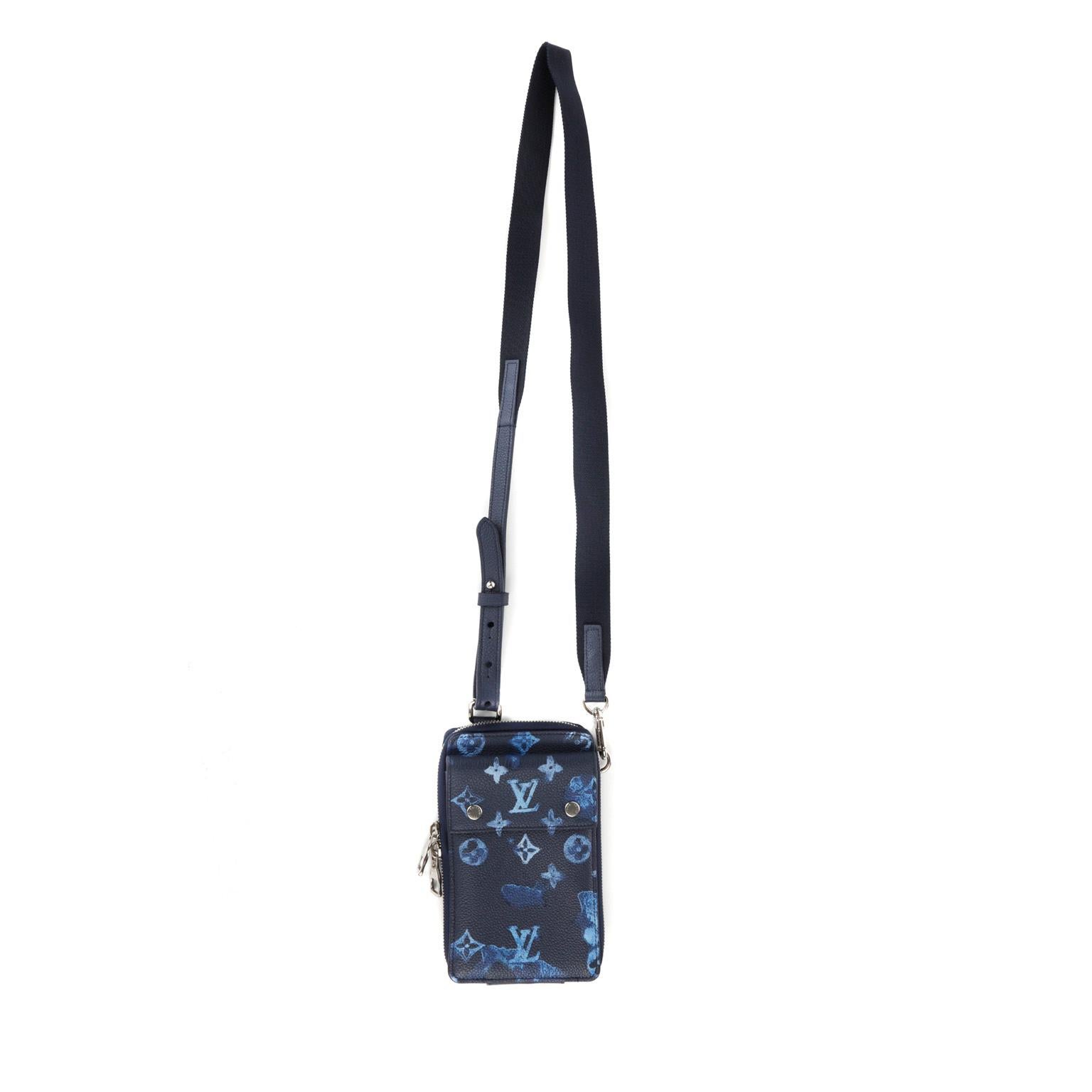 This authentic Louis Vuitton Blue Monogram Watercolor Crossbody Phone Case is in pristine condition.  Limited Edition, zip around opening, removable strap with adjustable length.

PBF 13171