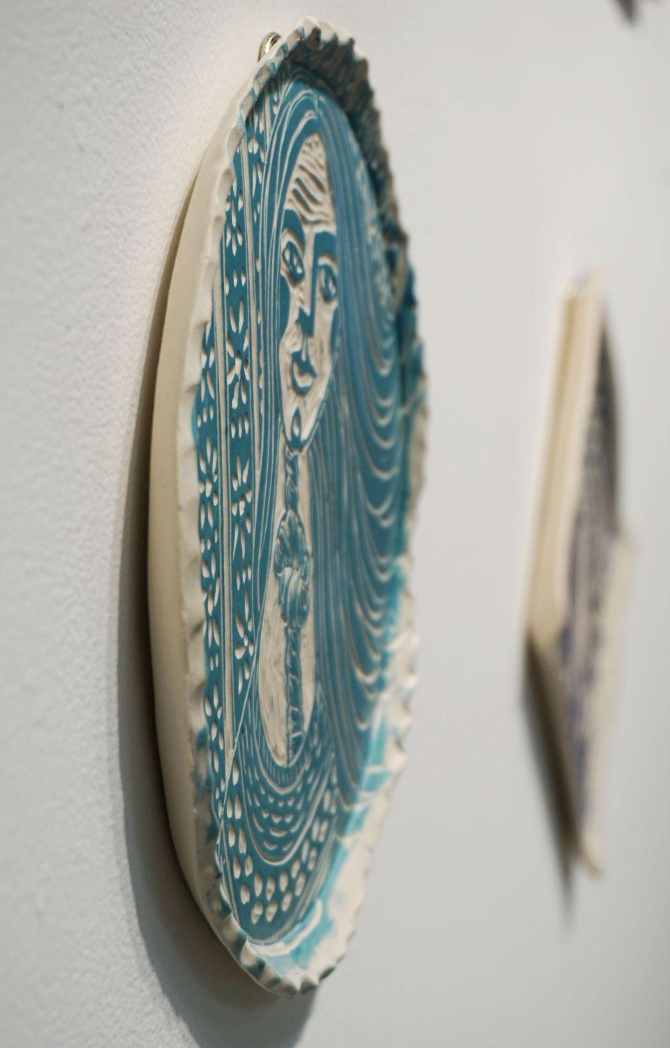 Our history here 
2018 
Hand carved porcelain plate 
One of a kind 

Her poetic porcelain plates examine and reimagine the history of art in a way that values women, not only in body, but in wholeness, power, and love. Focusing on the narrative