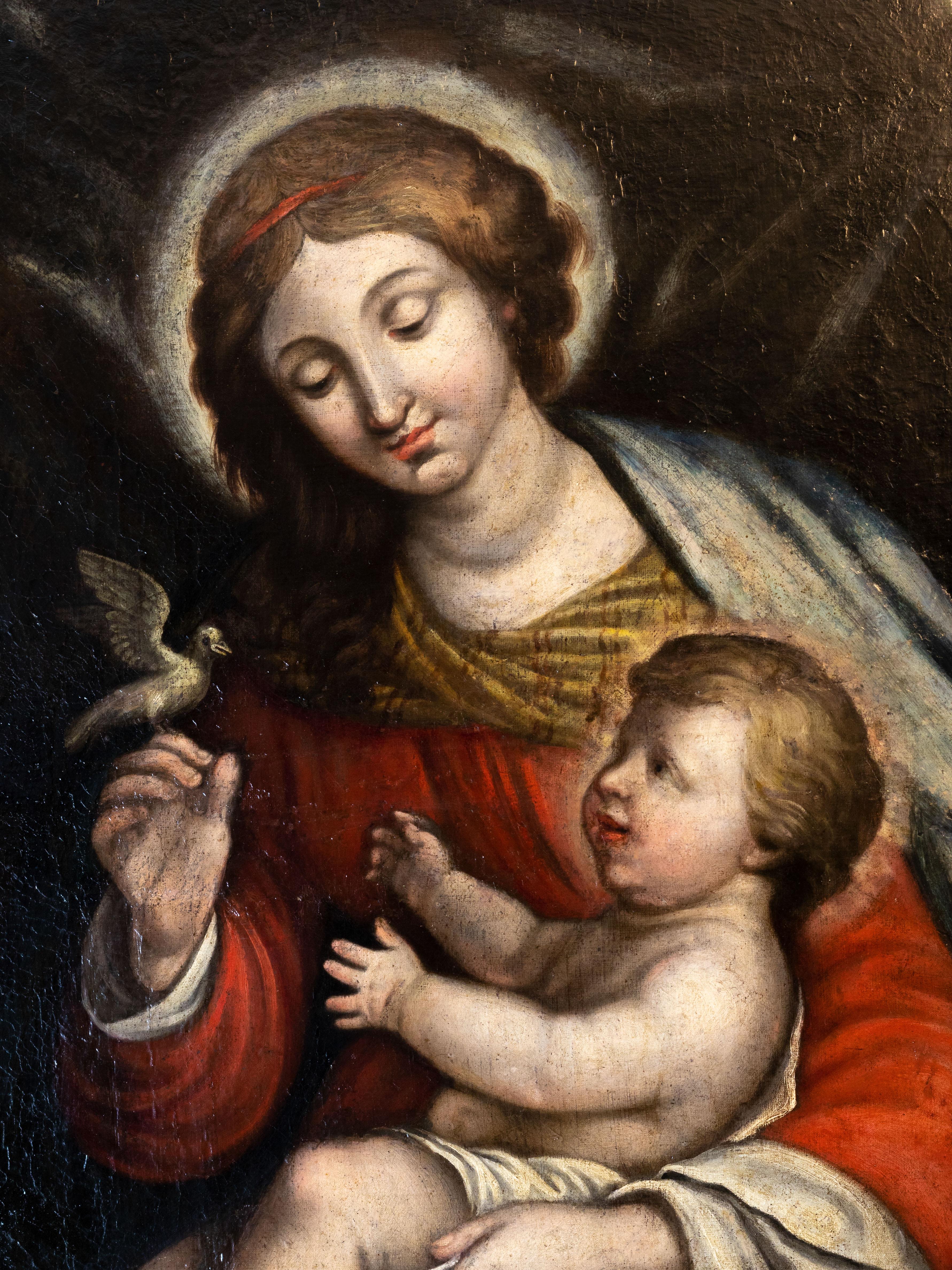 An 18th-century Italian Renaissance oil painting of Our Lady of Peace, depicting Mary in red and green robes holding the Christ Child and a white dove. Against a dark, atmospheric background, the Virgin radiates serenity, symbolizing hope and divine