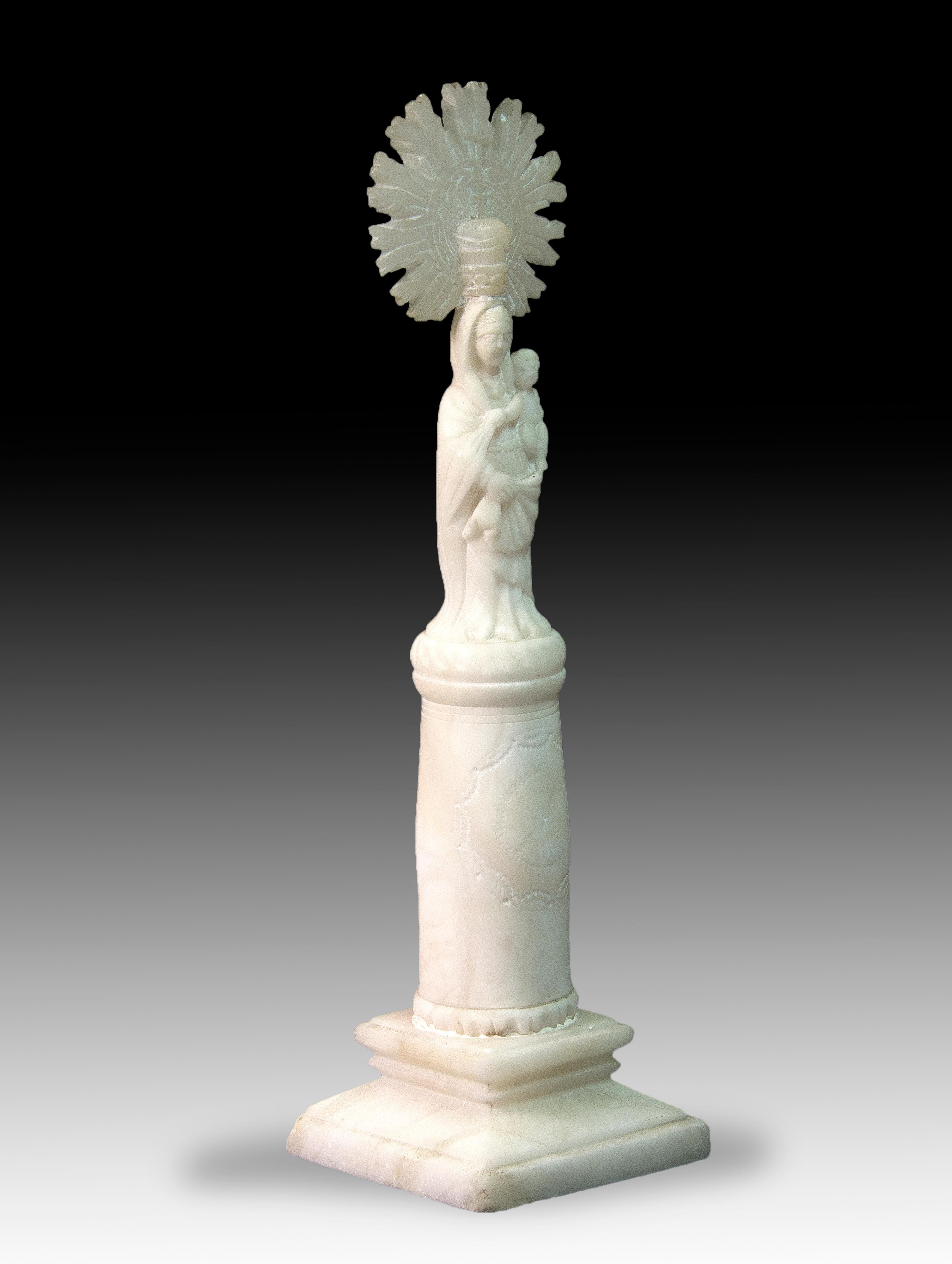 Virgin of the Pillar. Alabaster. Spain, XIX century. 
Carved alabaster figure showing the Virgen del Pilar de Zaragoza. Christian tradition indicates that, around the year 40, Mary appeared to Santiago Apóstol in Caesaraugusta (the future Zaragoza)