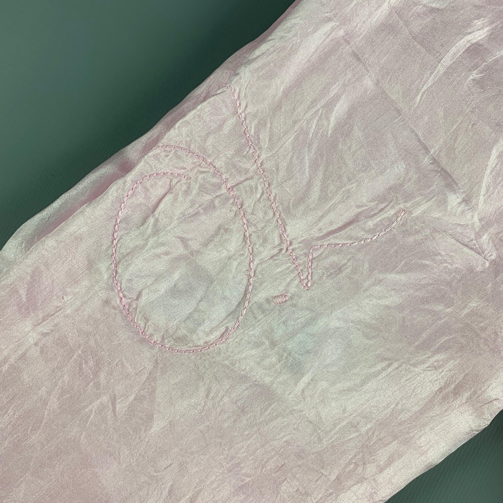 OUR LEGACY double silk scarf comes in a pastel pink shade with monogram stitching. Excellent Pre-Owned Condition. 

Measurements: 
   12 inches  x 68 inches 
  
  
 
Reference: 125765
Category: Scarves
More Details
    
Brand:  OUR LEGACY
Gender: 