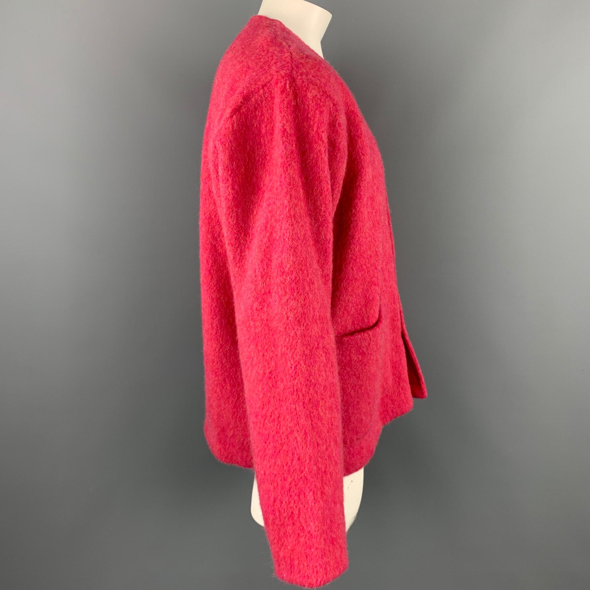 OUR LEGACY cardigan comes in a pink virgin wool featuring a v-neck, patch pockets, and a buttoned closure. ade in Portugal.

Excellent Pre-Owned Condition.
Marked: 50

Measurements:

Shoulder: 20 in. 
Chest: 48 in. 
Sleeve: 26 in. 
Length: 28.5 in.