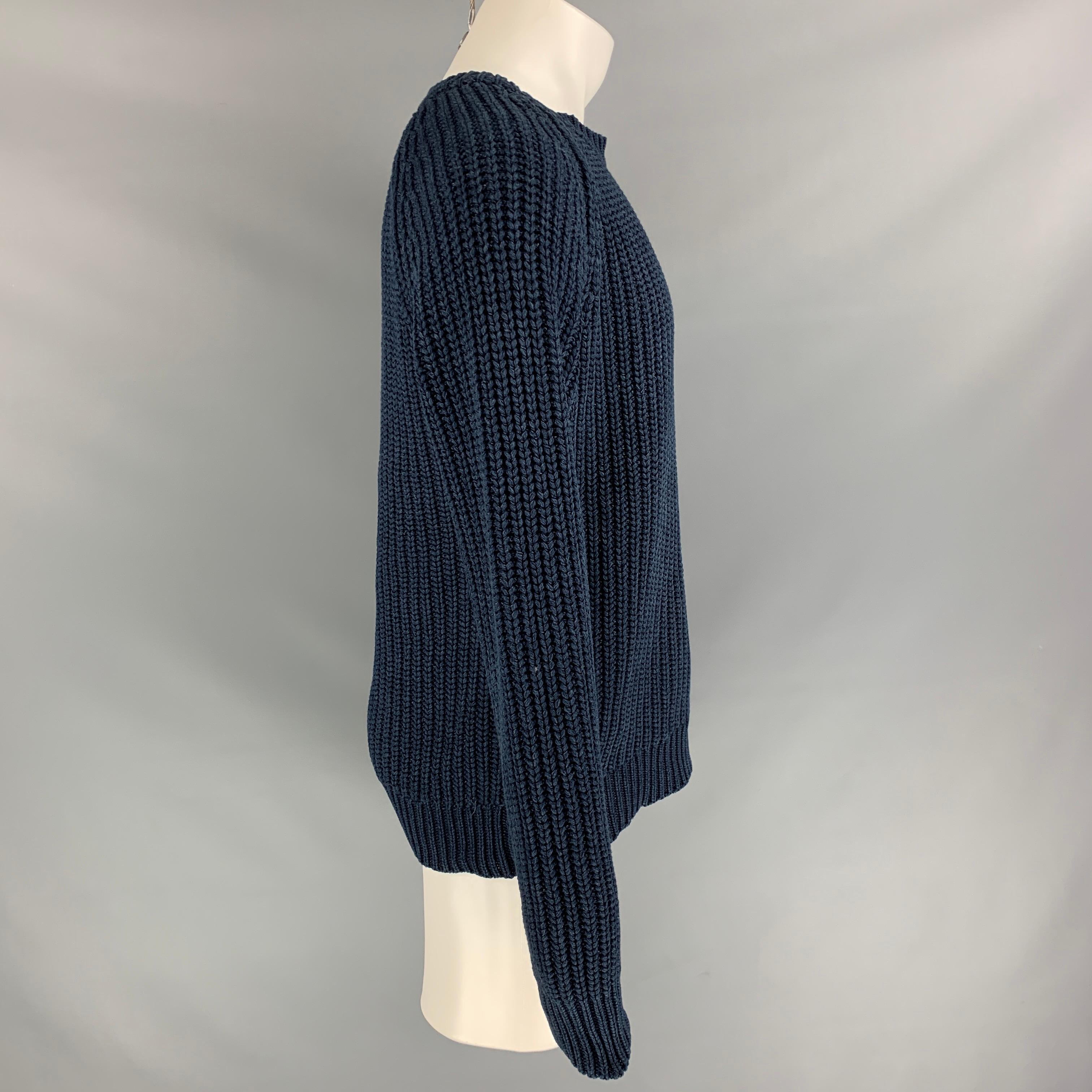 OUR LEGACY sweater comes in a navy knitted cotton featuring long sleeves and a turtleneck. Made in Portugal.

Very Good Pre-Owned Condition.
Marked: 50

Measurements:

Shoulder: 17.5 in.
Chest: 40 in.
Sleeve: 29 in.
Length: 17.5 in. 