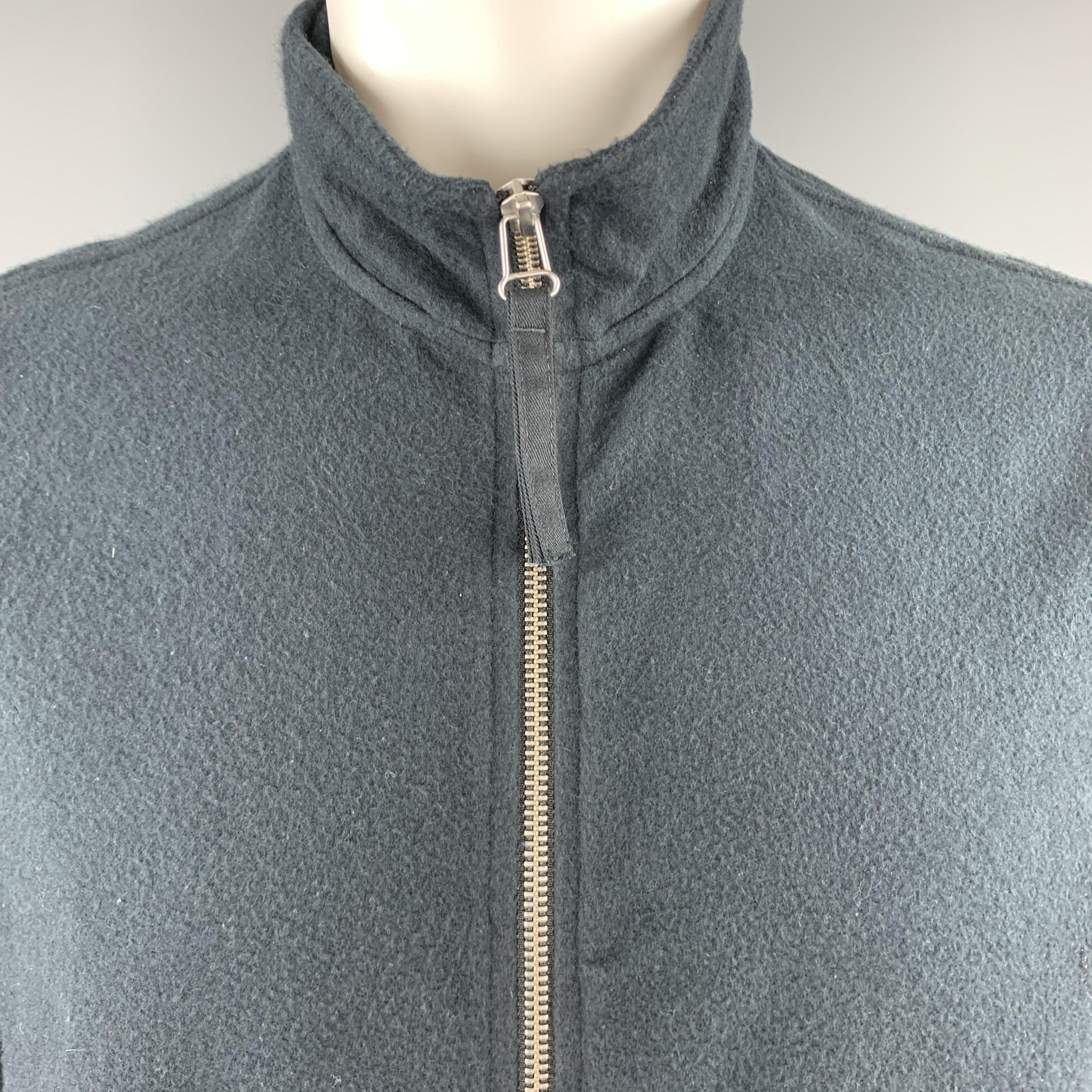 OUR LEGACY jacket comes in soft textured cotton with a high neck, zip front, and side zip pockets. Made in Portugal.

Good Pre-Owned Condition.
Marked: IT 48

Measurements:

Shoulder: 18 in.
Chest: 45 in.
Sleeve: 26 in.
Length: 28 in.