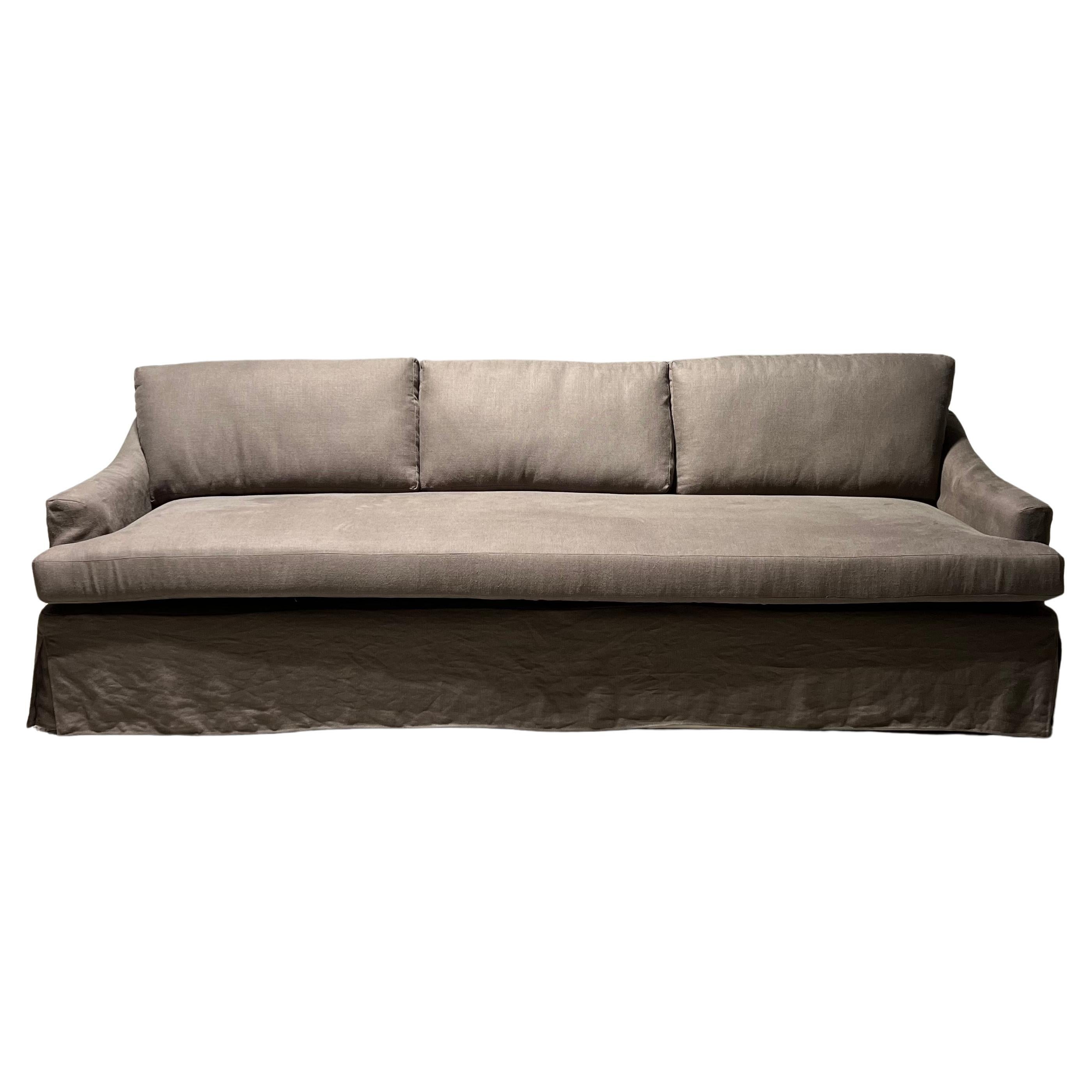 Our Signature Deb Lounging Sofa finished with Linen Loose Cover For Sale