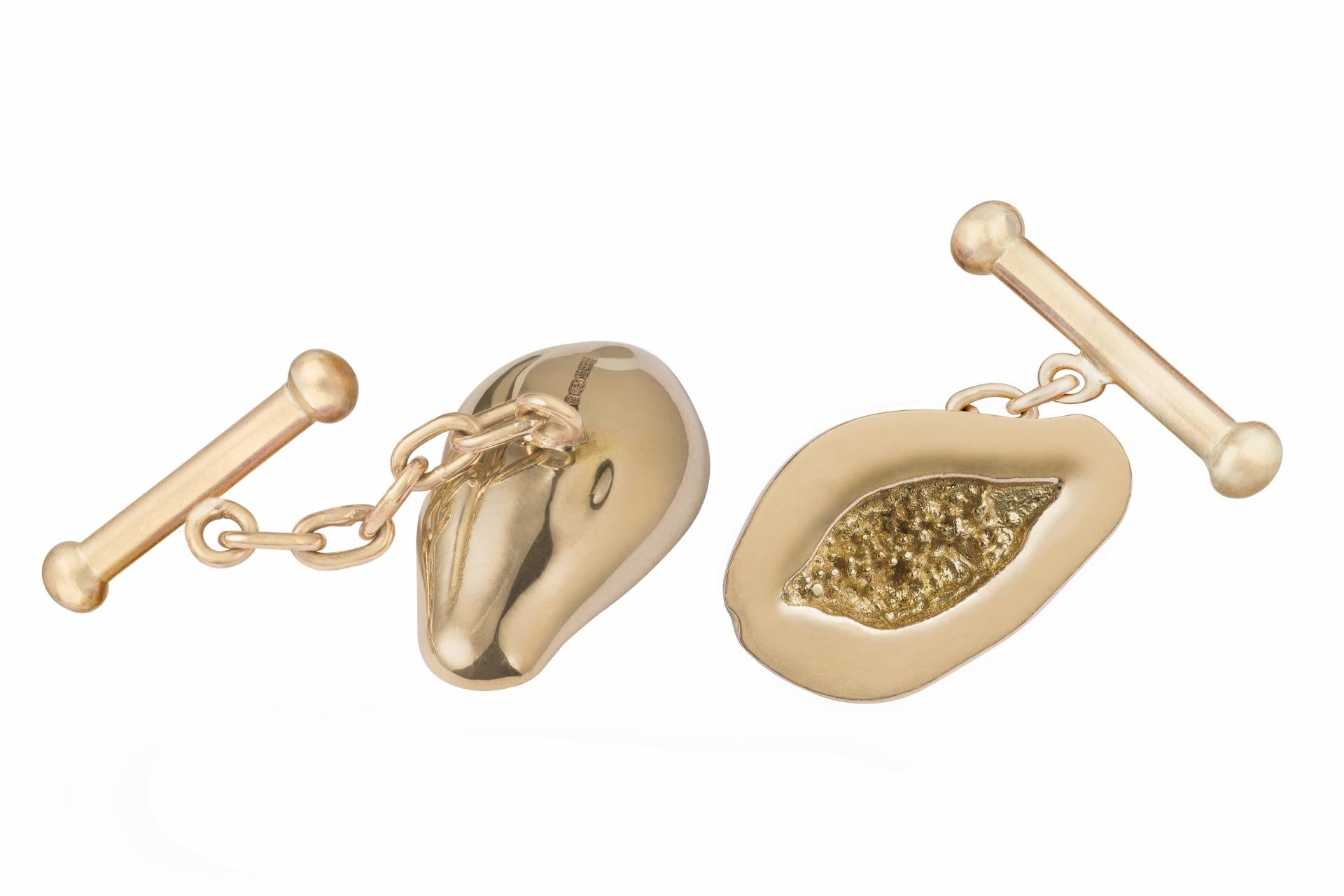 Gold, 18k, papaya cufflinks with a chain and bar.

If these are out of stock they are made to order and take 4 to 6 weeks. 

OUROBOROS is an artisanal brand, based out of Jaipur and designed by the British designer, Olivia Young. Each piece is