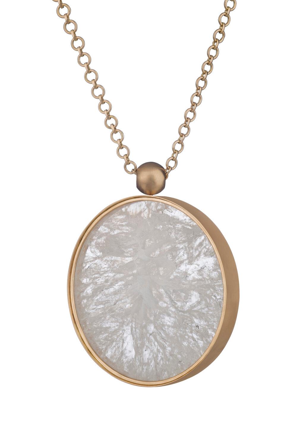 OUROBOROS white agate set in 18kt gold.

There are four chain options, all are handmade, 36