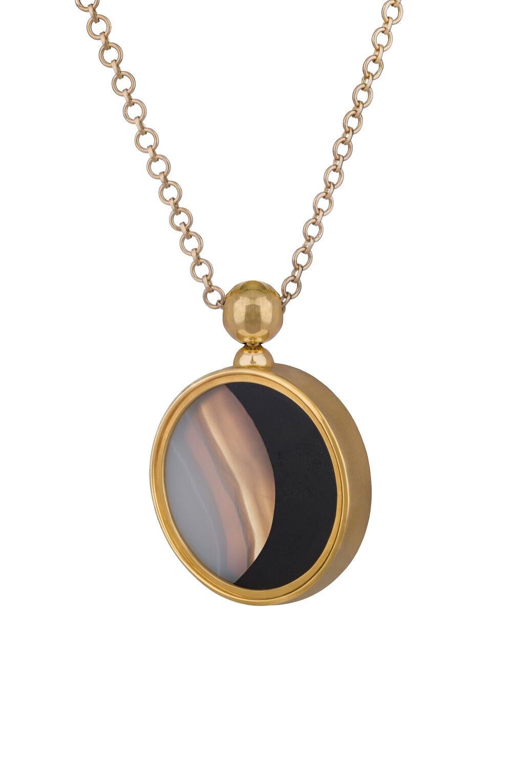OUROBOROS white and black agate pendant set in 18kt gold.

There are four chain options, all are handmade, 36