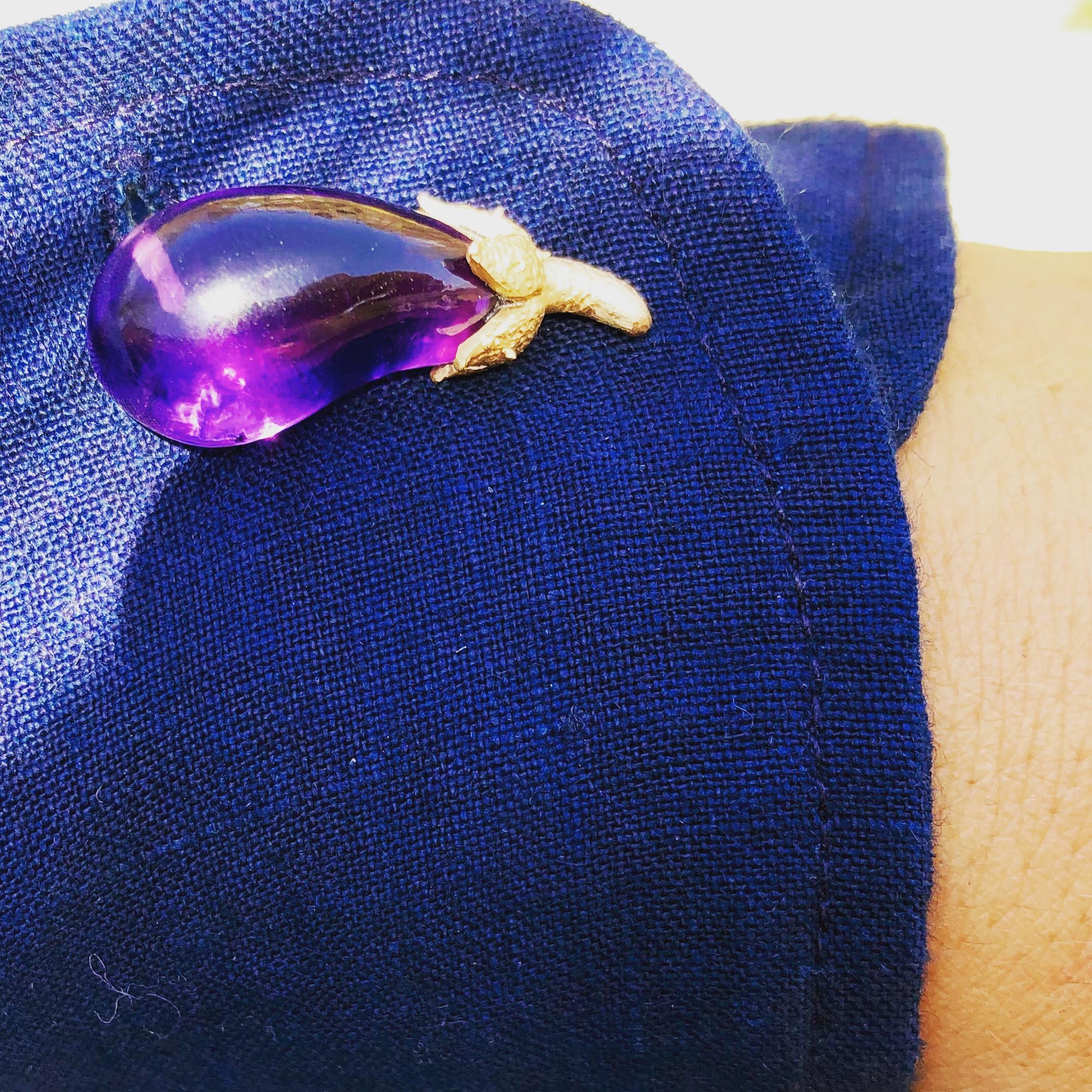 OUROBOROS hand carved amethyst as aubergines with hand made solid 18kt gold links and bar cufflinks. 

OUROBOROS’ commitment to using only the most unique stones set in 18 or 24 Karat gold, is matched only to Olivia’s commitment to the conditions