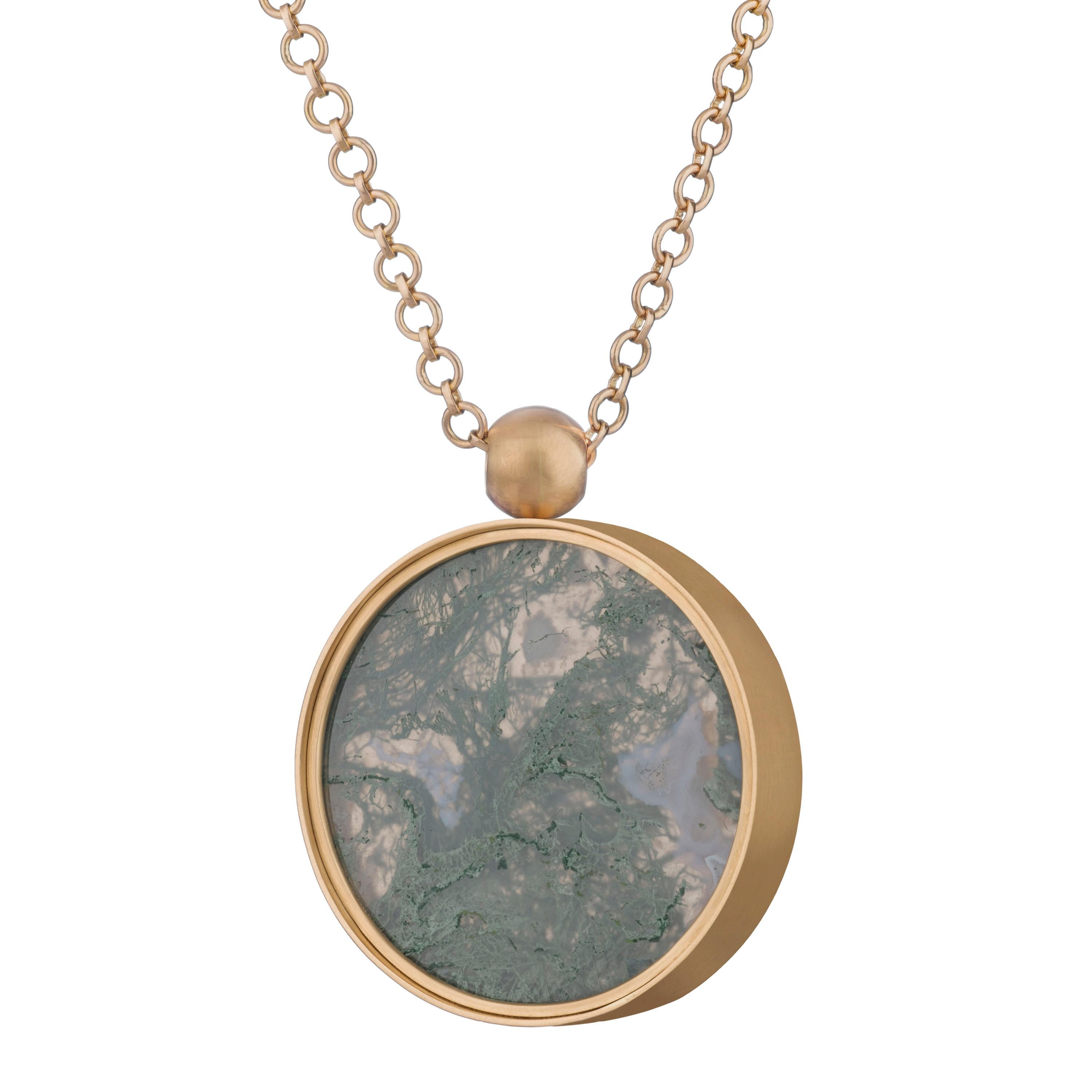 Ouroboros moss agate swivel pendant necklace set in 18 karat gold on a handmade 18 karat gold chain, with an 18 karat gold Ouroboros lasered ball to finish the back. 

This is part of the 'Any Colour You Like' (the founder's favourite track from the