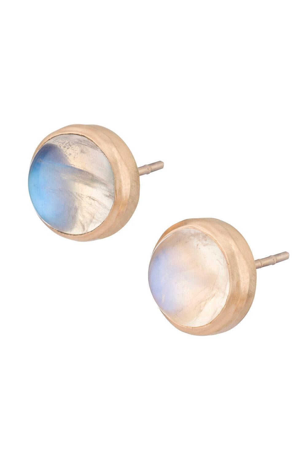 OUROBOROS rainbow moonstone round cabochon studs in a simple frame of 18kt gold studs. Blue and white rainbow moonstone options.

OUROBOROS’ commitment to using only the most unique stones set in 18 or 24 Karat gold, is matched only to Olivia’s