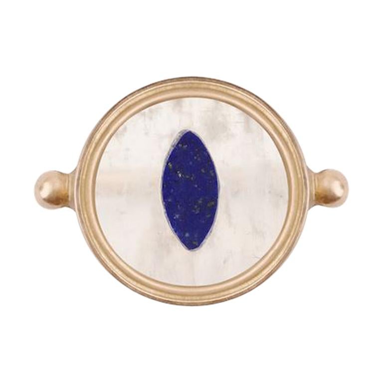 Ouroboros inlaid rainbow moonstone and lapis lazuli 18 karat gold handmade snake eye ring. 

This piece is made completely by hand and if it is out of stock take 4 to 6 weeks to produce. 

Please let us know your ring size and it will be either made