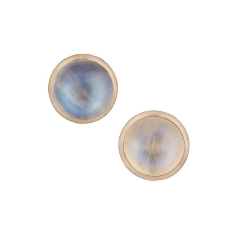 Ouroboros rainbow moonstone round cabochon handmade studs in a simple frame of 18 karat gold studs. 

Blue and white rainbow moonstone options. 

This piece is made completely by hand and if it is out of stock takes 4 to 6 weeks to produce.