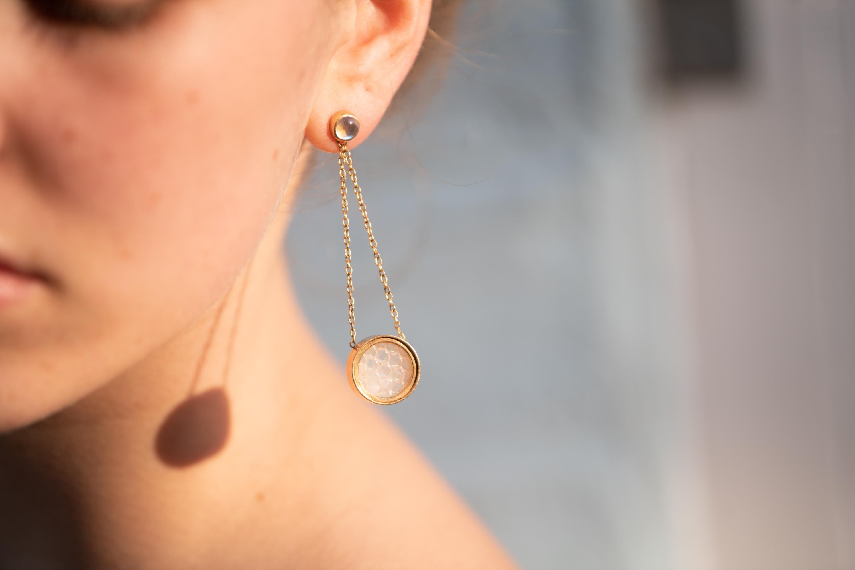 Ouroboros snake scale carved rainbow moonstone pendant earrings with a rainbow moonstone round cabochon stud, handmade in 18 karat gold. 

This piece is made completely by hand and if it is out of stock takes 4 to 6 weeks to produce. 

OUROBOROS is