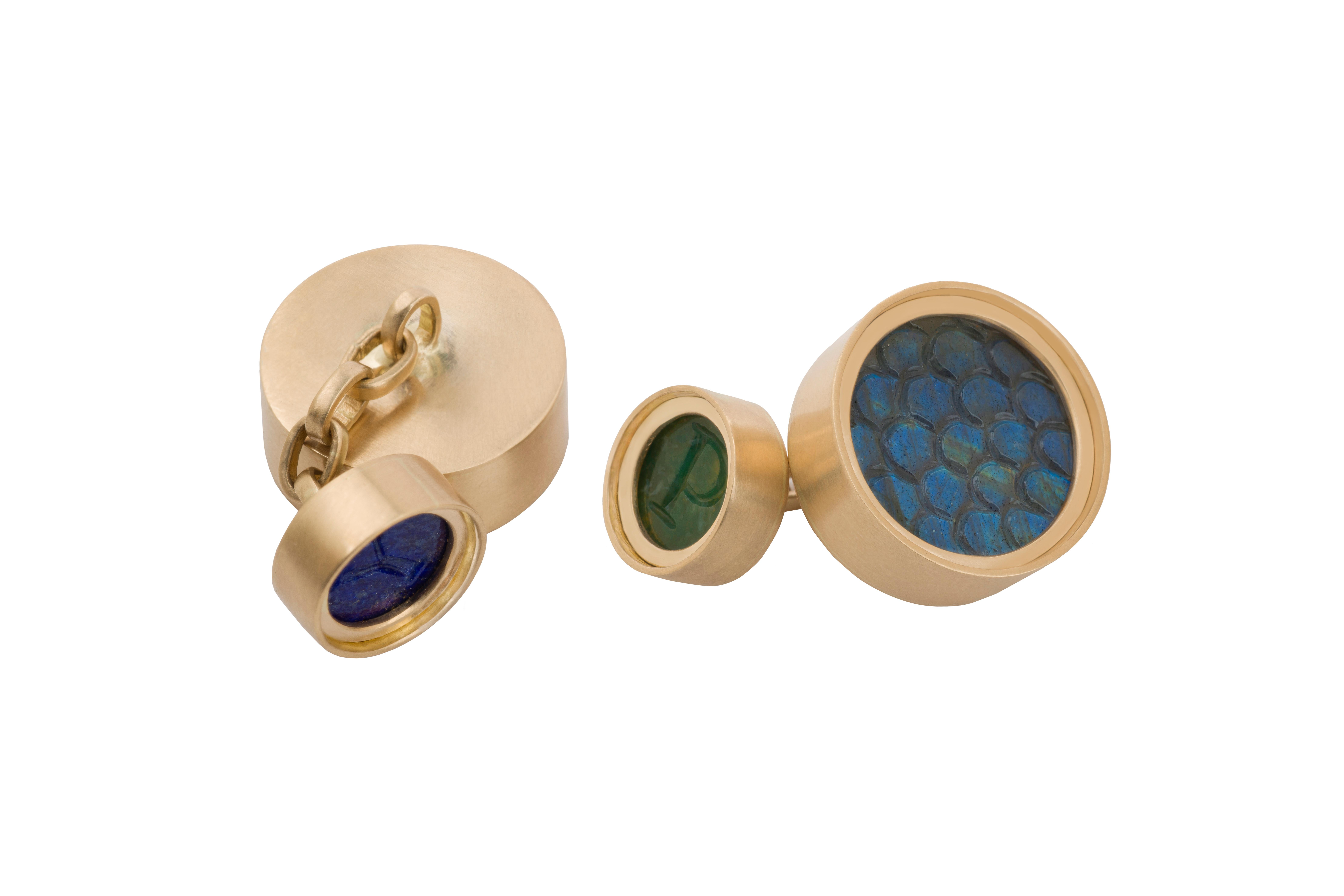 OUROBOROS snakeskin carved rainbow moonstone, blue labradorite, moss agate and lapis lazuli cufflinks set in 18kt gold.

OUROBOROS’ commitment to using only the most unique stones set in 18 or 24 Karat gold, is matched only to Olivia’s commitment to