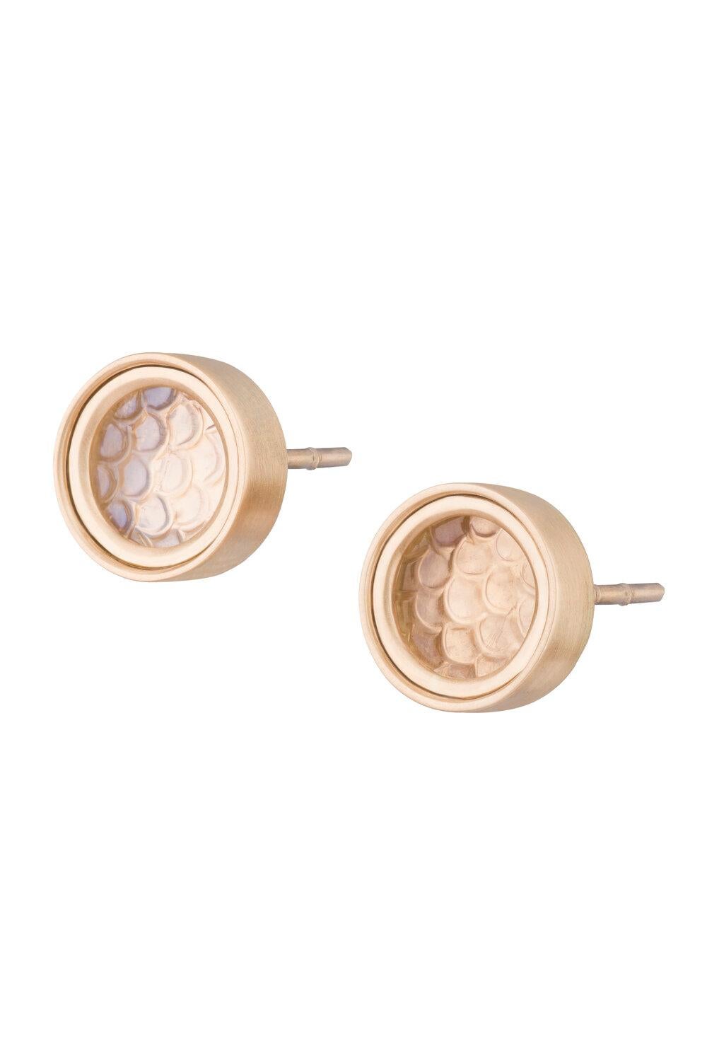 OUROBOROS snakeskin carved rainbow moonstone studs set in an 18kt gold ridged frame setting. Blue and white rainbow moonstone options. 

OUROBOROS’ commitment to using only the most unique stones set in 18 or 24 Karat gold, is matched only to