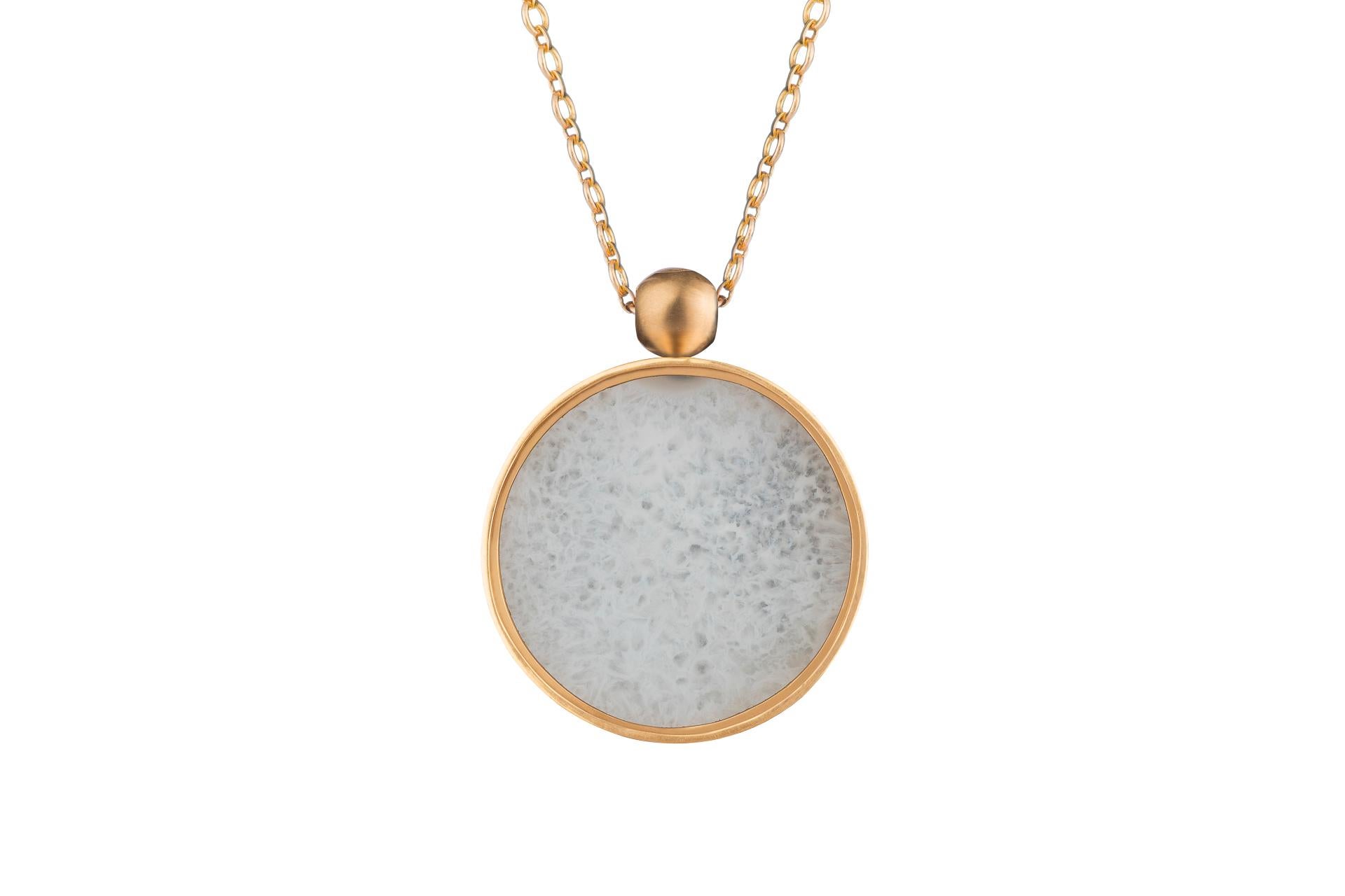 BABY SLICE OF THE MOON
White agate set in 18kt gold pendant, this pricing is without the chain.  There is also a black rhodium plated silver chain option.

If this item is out of stock. Everything is made to order and can take 4-6 weeks.

OUROBOROS