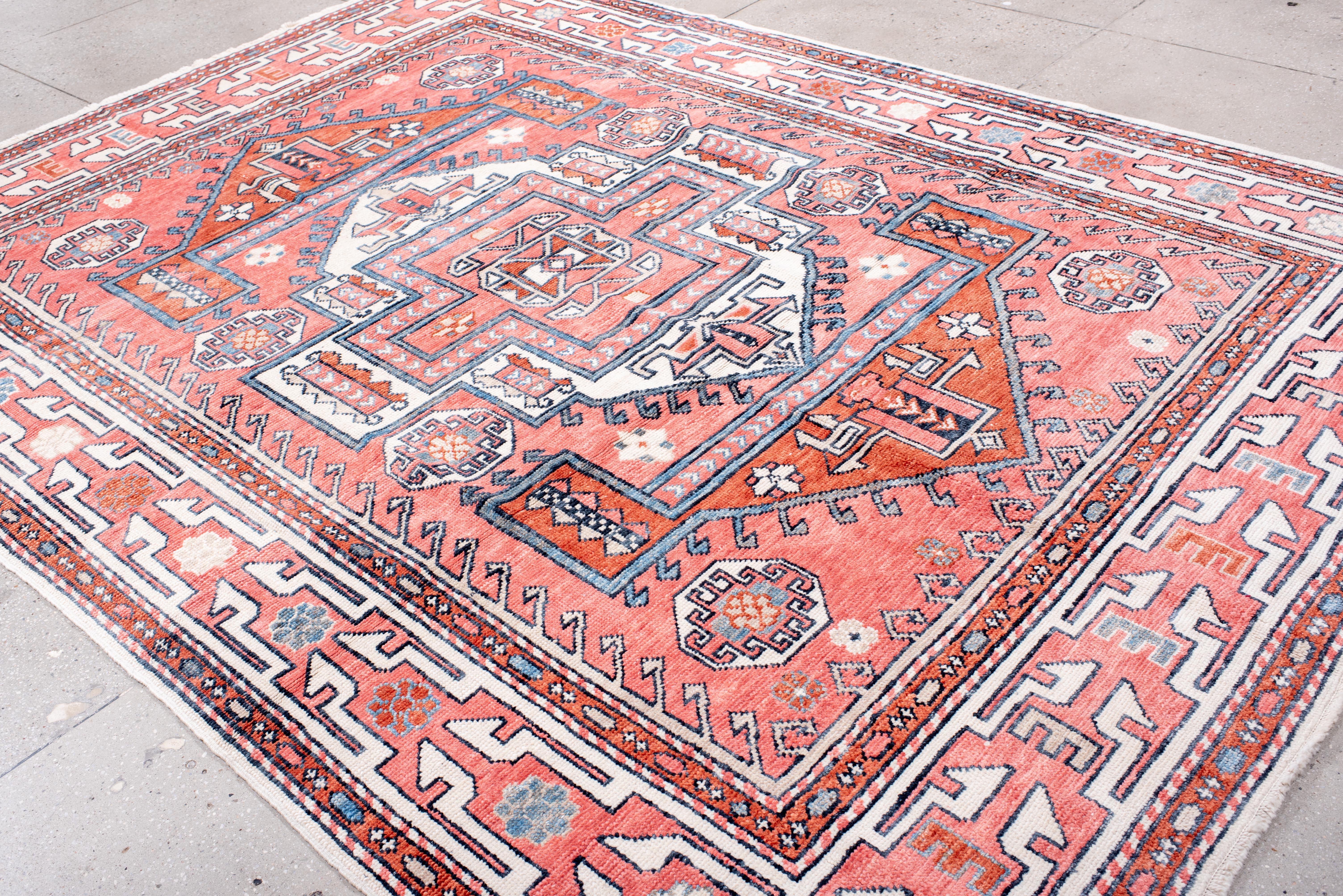 An expressive composition of bold geometry and intricate detailing, this Oushak rug embodies heritage craftsmanship with a modern sensibility. The commanding central medallion is framed by a structured arrangement of stepped motifs and angular